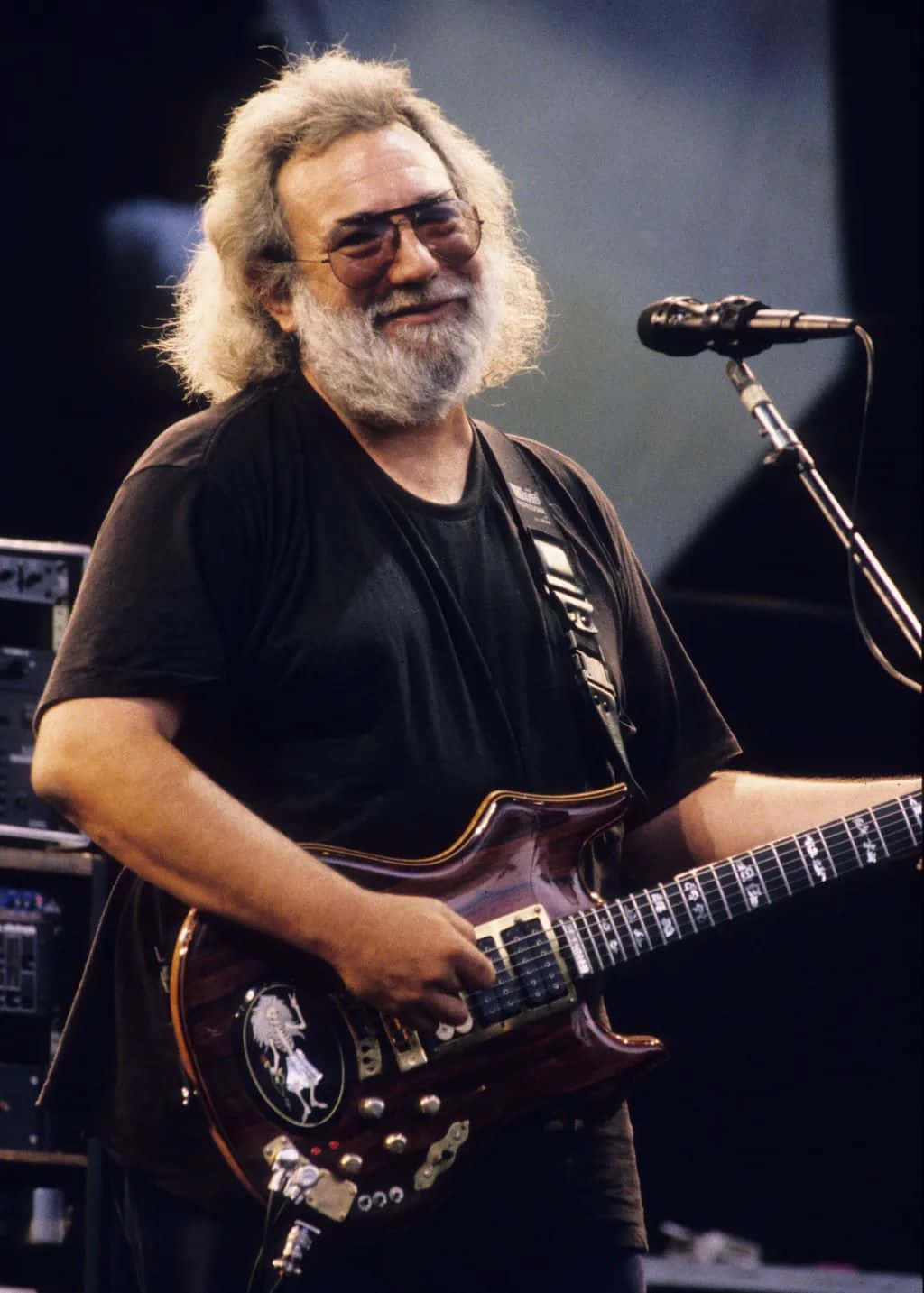 Jerry Garcia, dark wood electric guitar, dimly lit stage, HD Phone Wallpaper