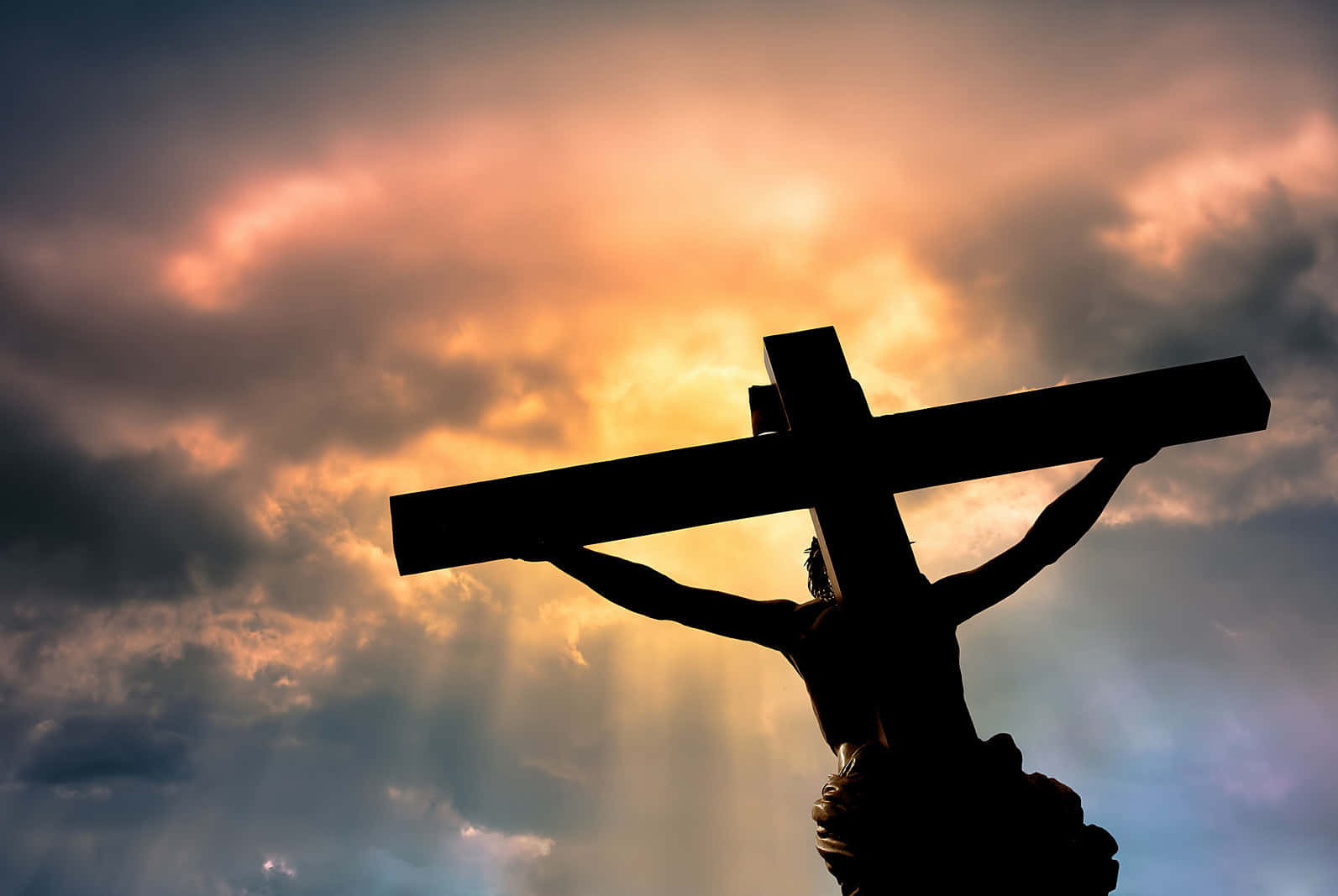 crucifixion statue, dramatic sunset sky, radiant golden rays, HD Desktop Wallpaper
