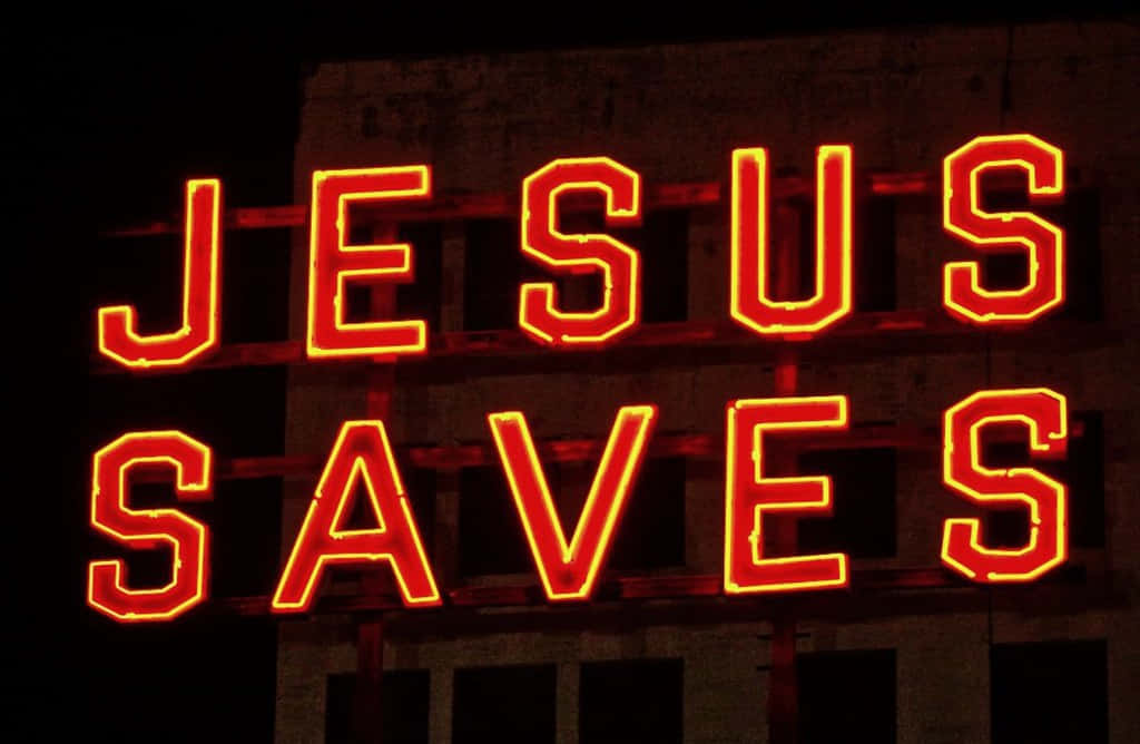 JESUS SAVES, glowing red neon sign, dark urban building facade, SD Desktop Wallpaper
