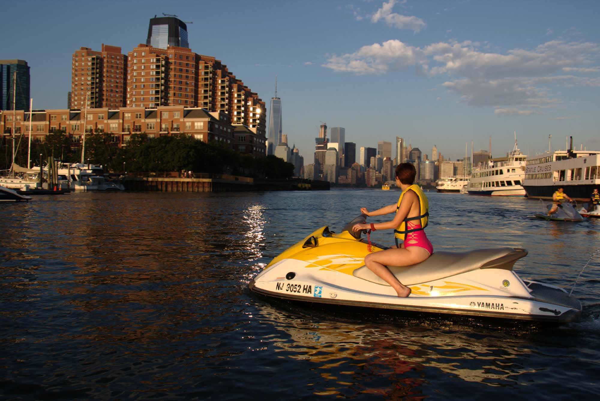 woman, pink swimsuit, yellow jet ski, Full HD Desktop Wallpaper