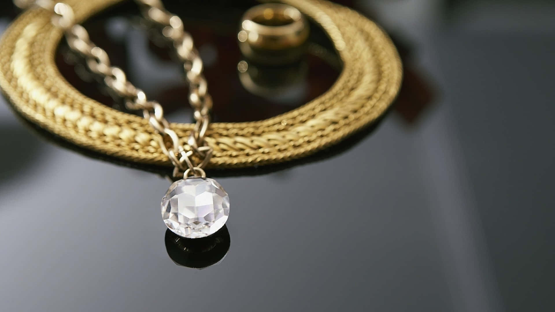 gold chain necklace, faceted crystal pendant, dark reflective surface, Full HD Desktop Wallpaper