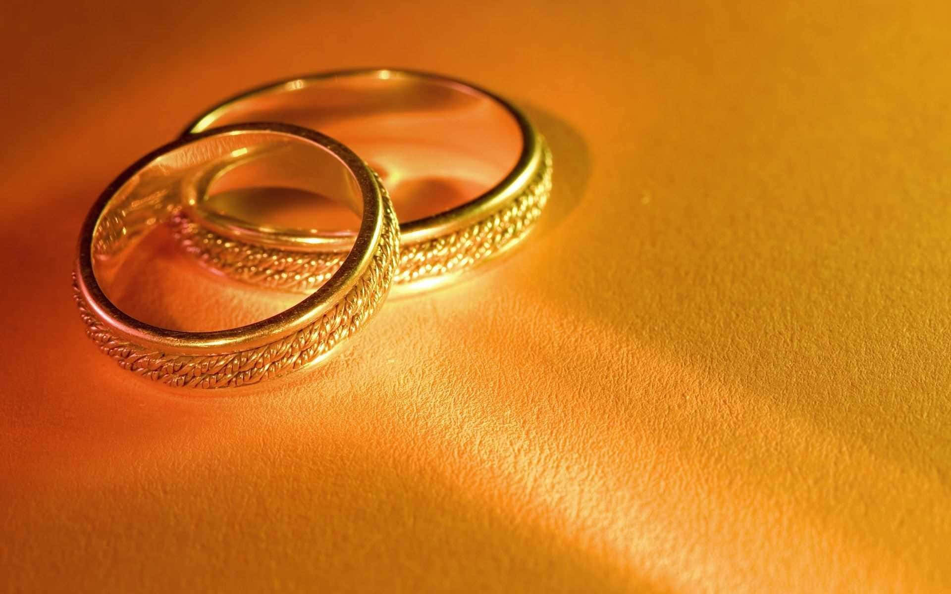 gold wedding bands, ornate, warm textured surface, Full HD Desktop Wallpaper