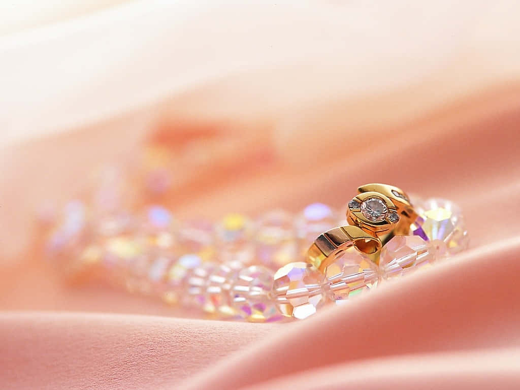 gold ring, sparkling stone, soft pink fabric, SD Desktop Wallpaper