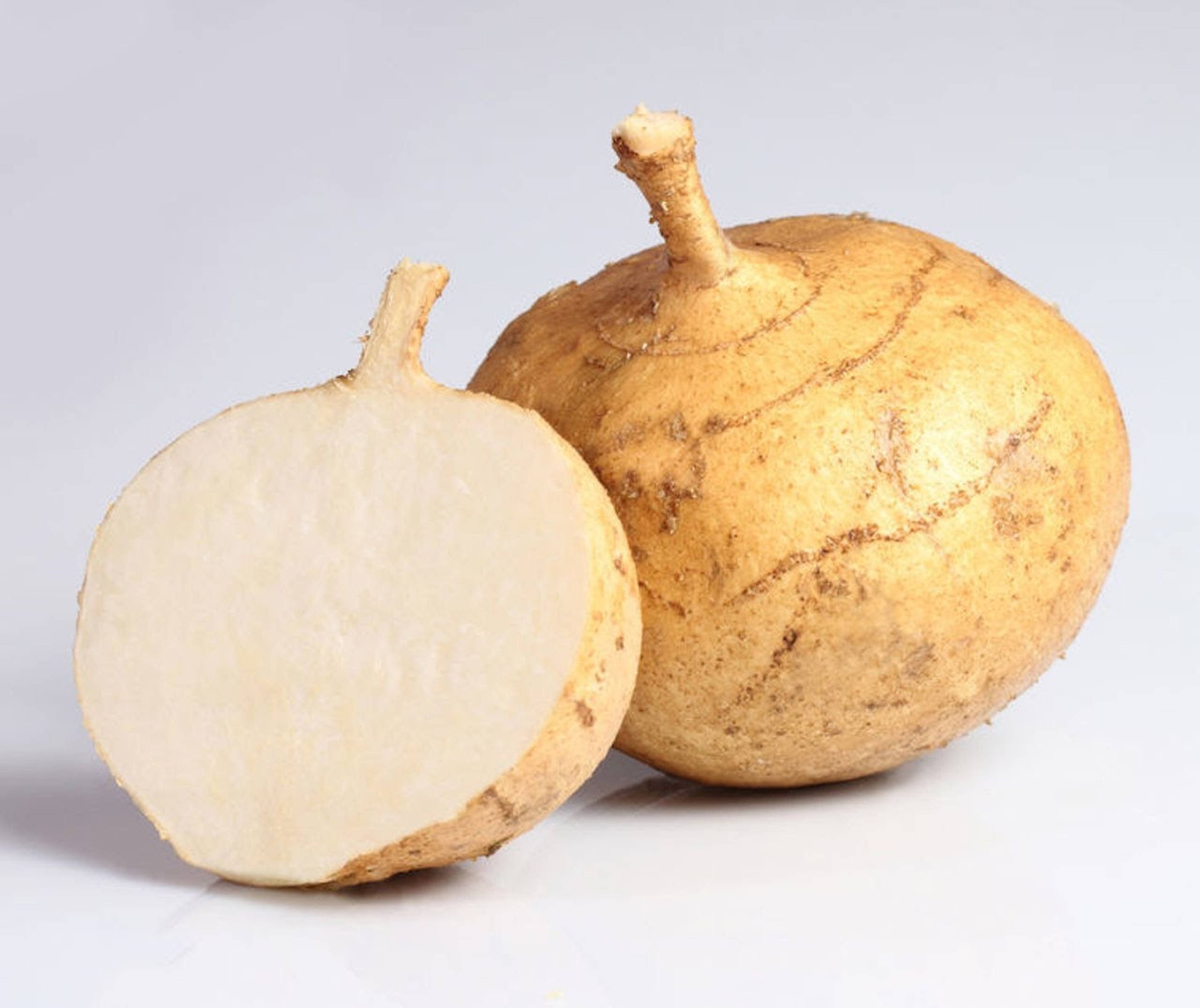 sliced open jicama, wooden cutting board, yellow-brown yam root, 2K Desktop Wallpaper