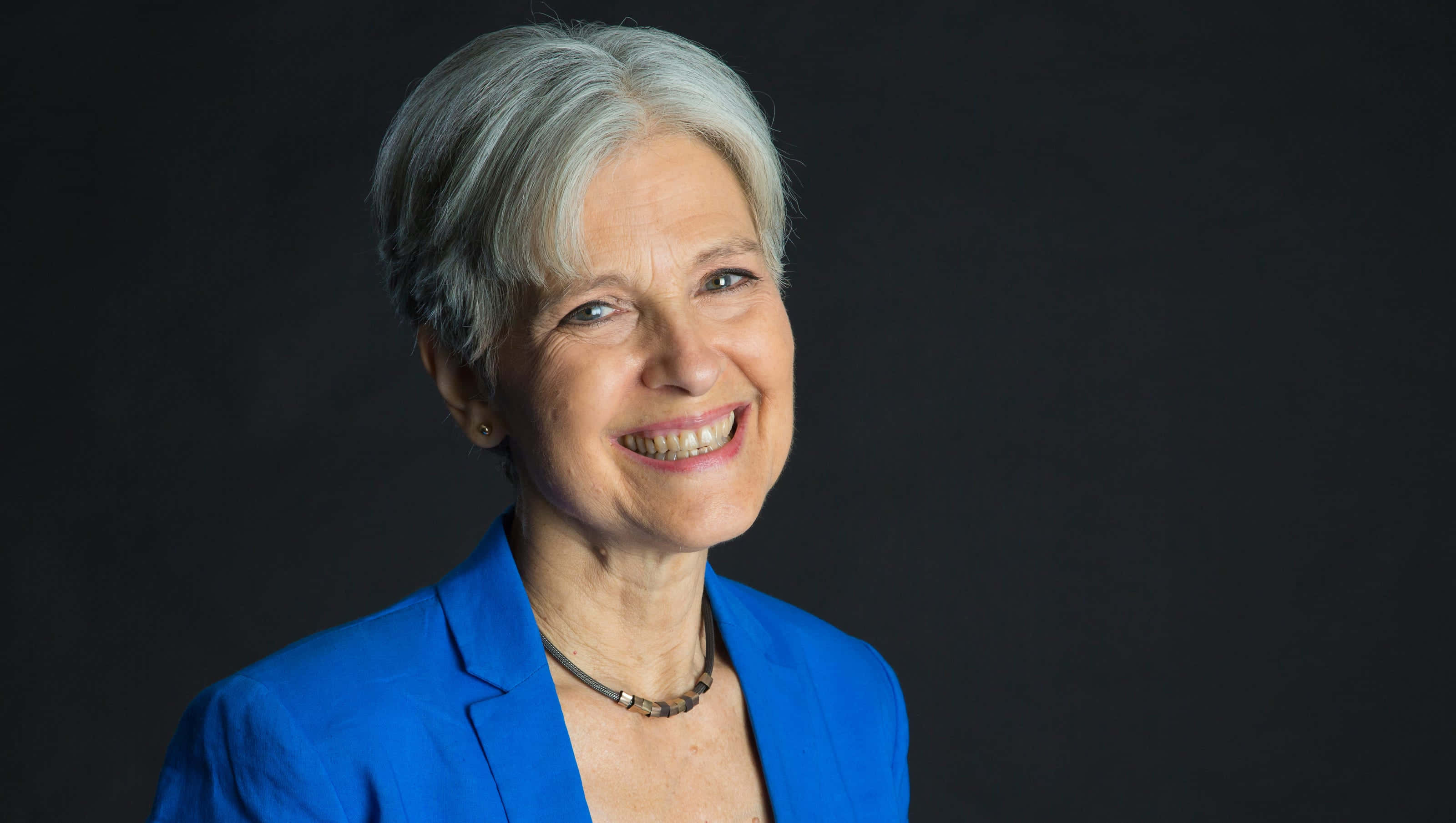 Jill Stein, short gray hair, bright blue blazer, 2K Desktop Wallpaper
