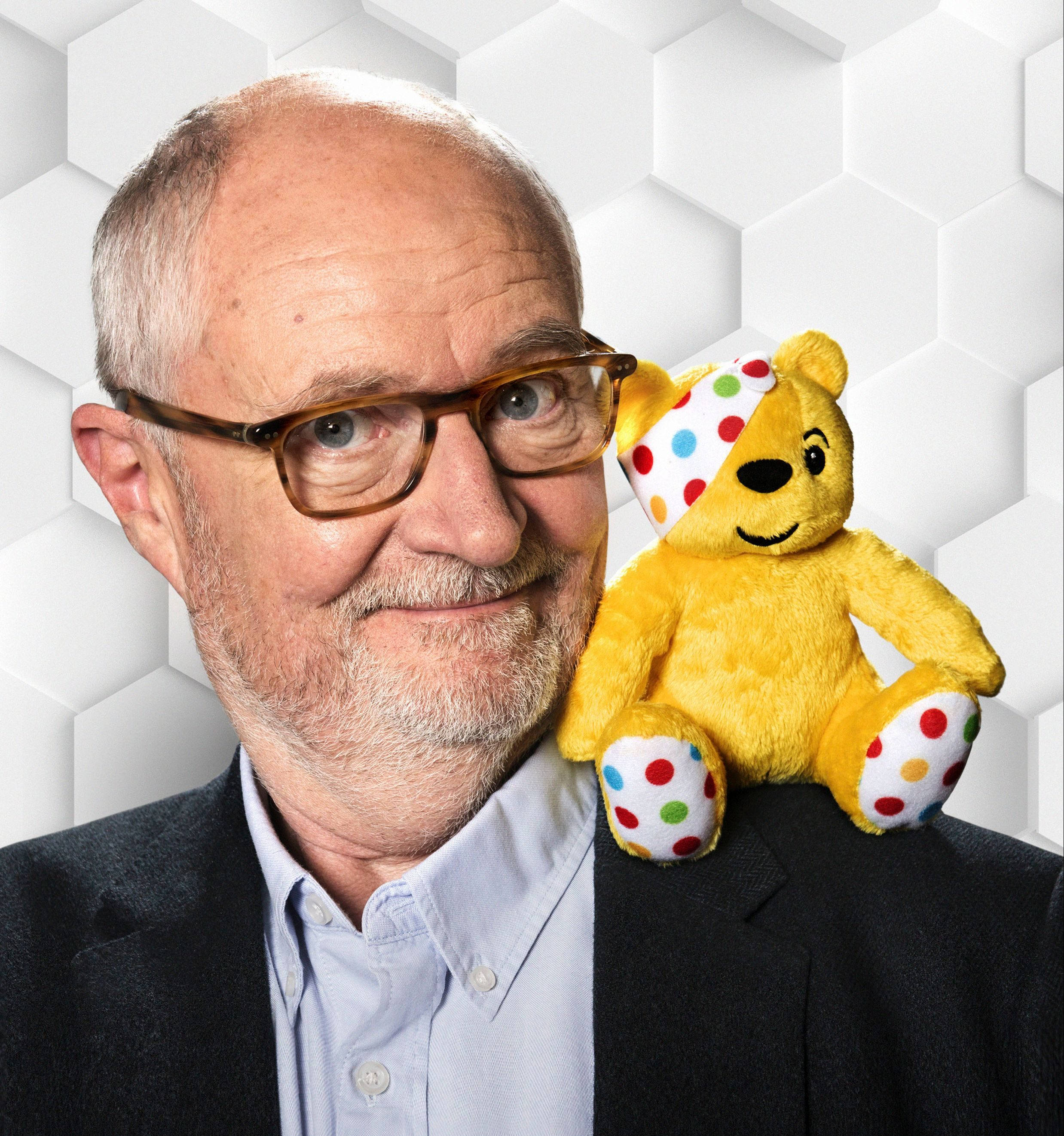 Jim Broadbent, Oscar-winning actor, yellow Pudsey Bear plush toy, 2K Phone Wallpaper