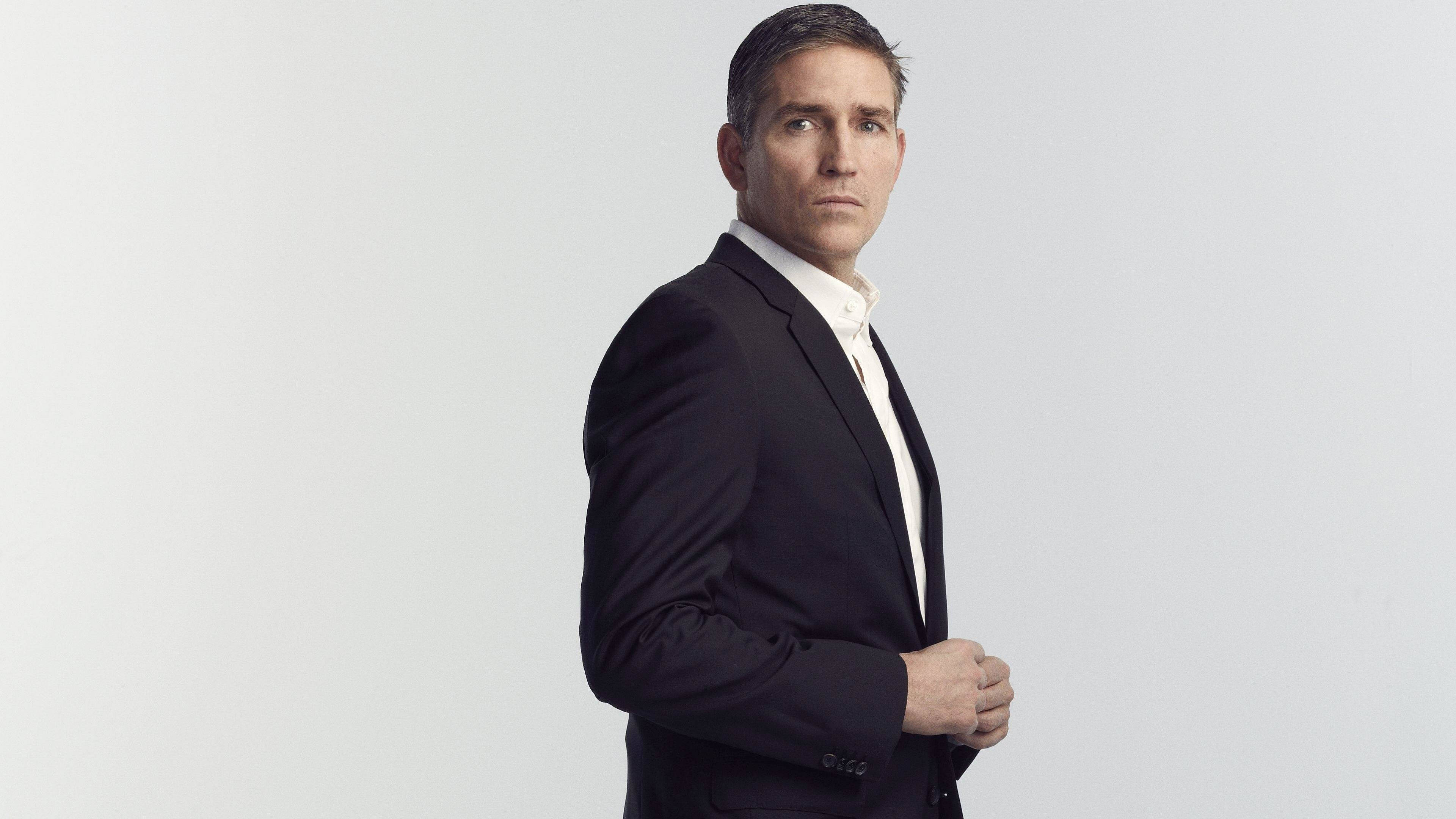 Jim Caviezel, dark suit, plain white background, 4K Desktop Wallpaper
