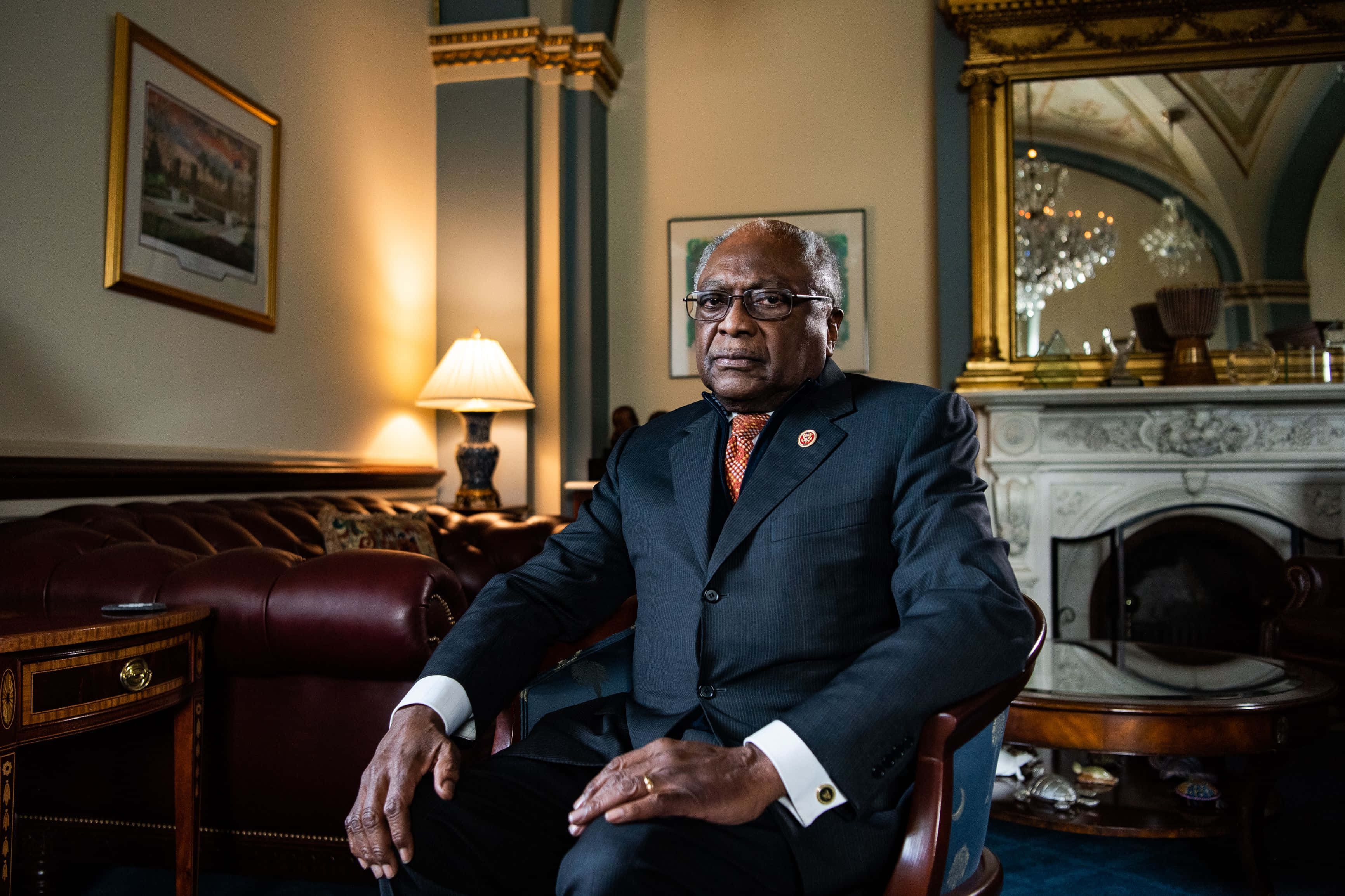Jim Clyburn, dark suit, richly decorated room, 2K Desktop Wallpaper