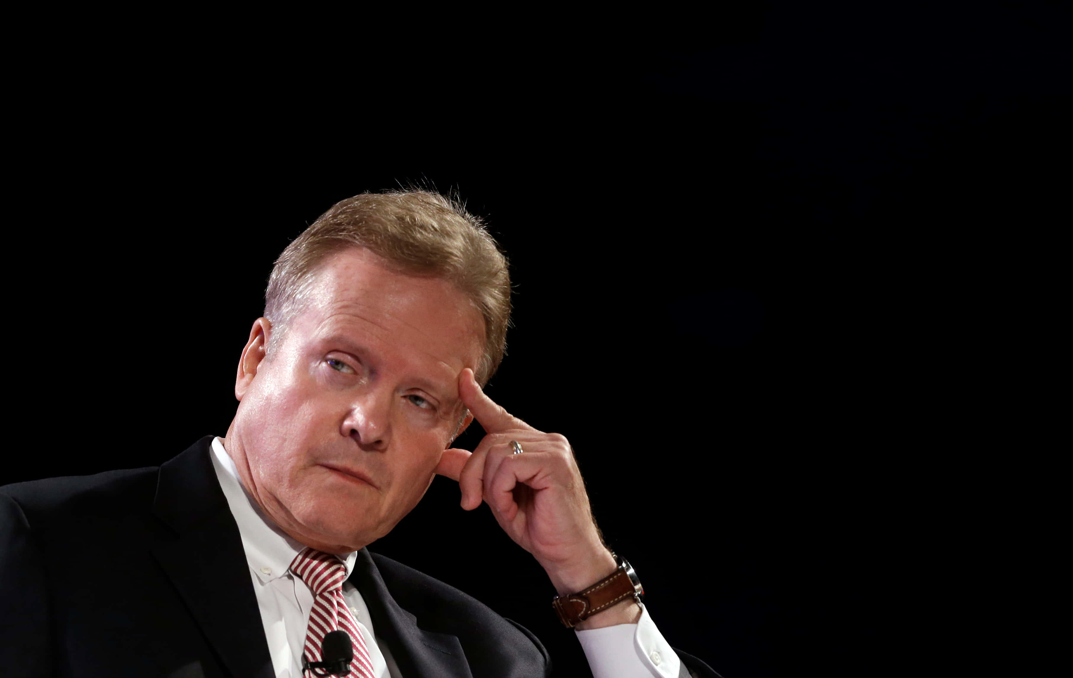 Jim Webb, finger on forehead, suit and tie, 2K Desktop Wallpaper