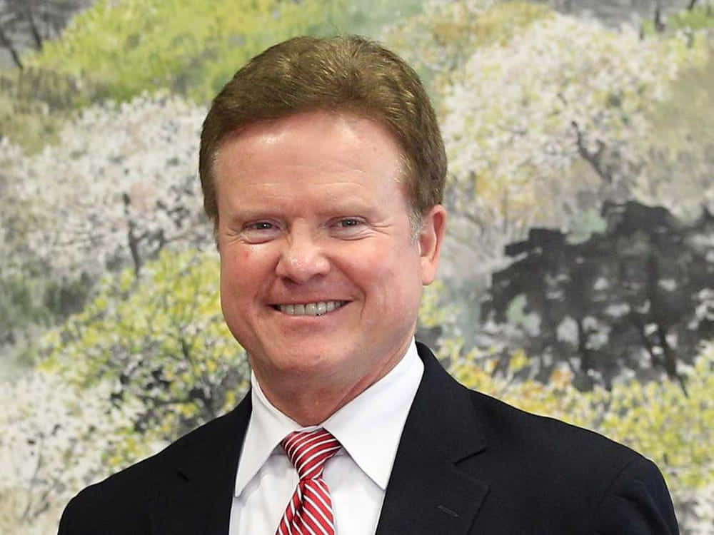 Jim Webb, dark suit, red striped tie, SD Desktop Wallpaper