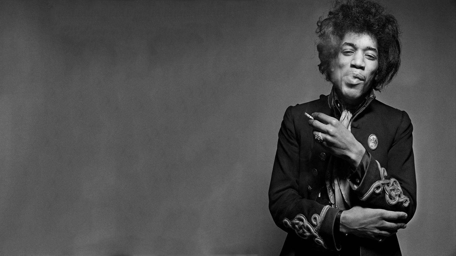 Jimi Hendrix, smoking a cigarette, playful smirk, Full HD Desktop Wallpaper