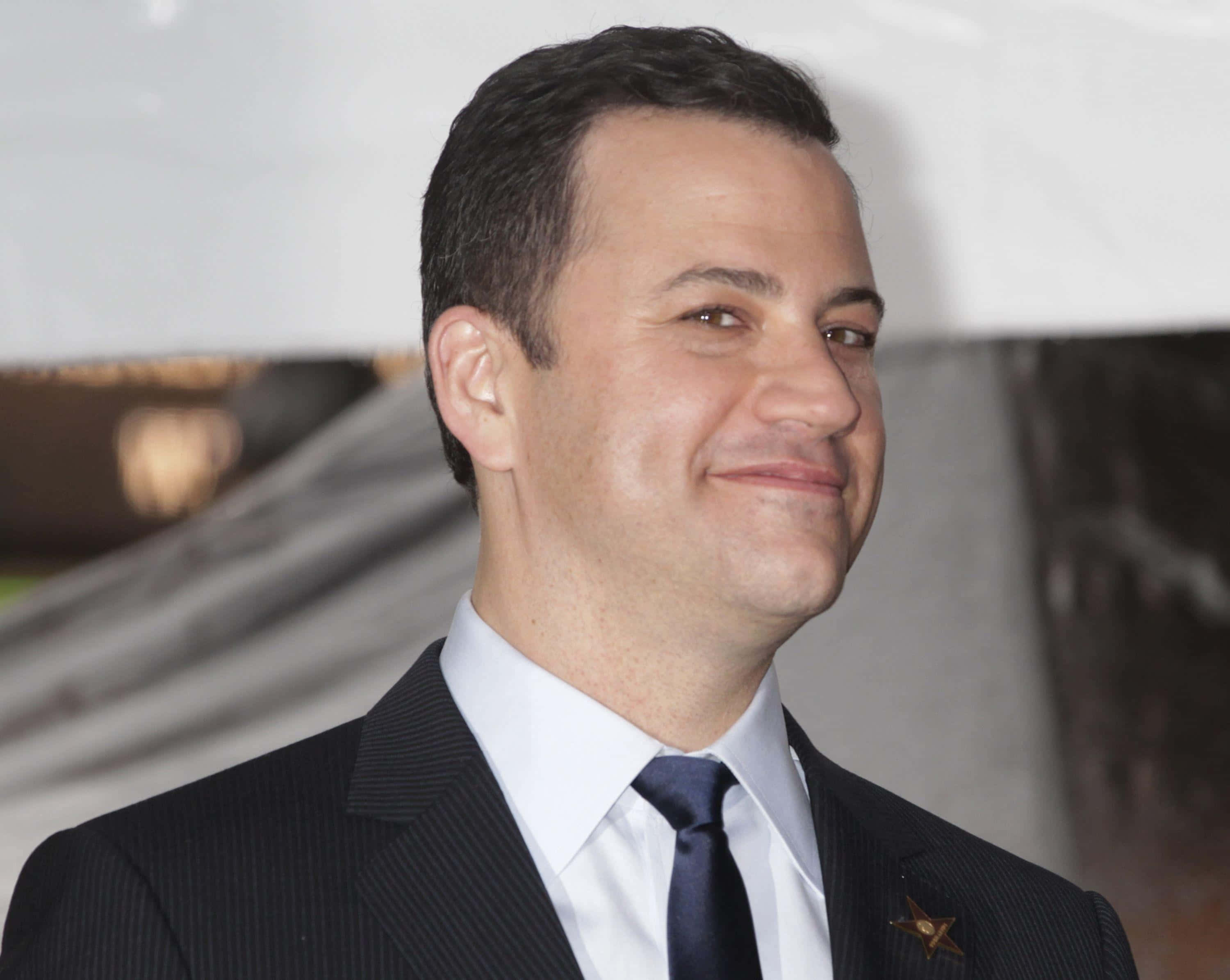 Jimmy Kimmel, dark pinstripe suit, navy tie, 2K Desktop Wallpaper