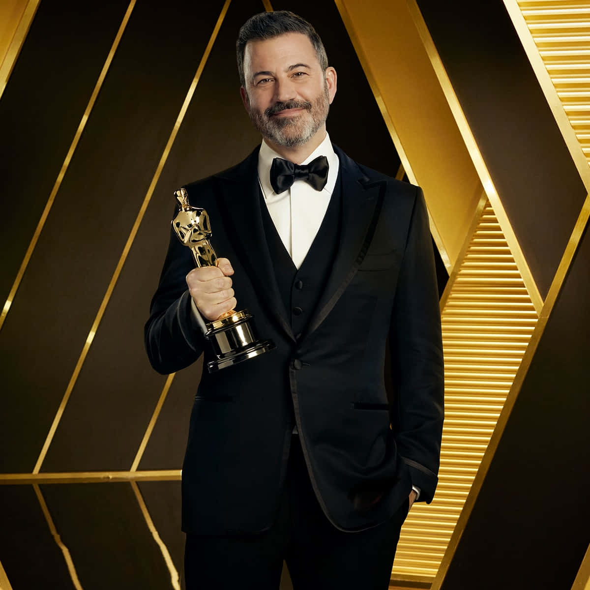Jimmy Kimmel, black tuxedo, golden Oscar statue, SD Desktop Wallpaper