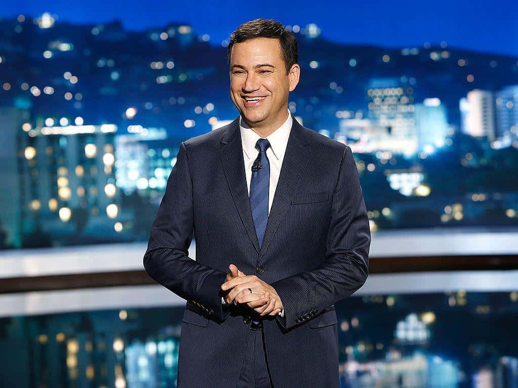 Jimmy Kimmel, dark suit, blurred cityscape, SD Desktop Wallpaper