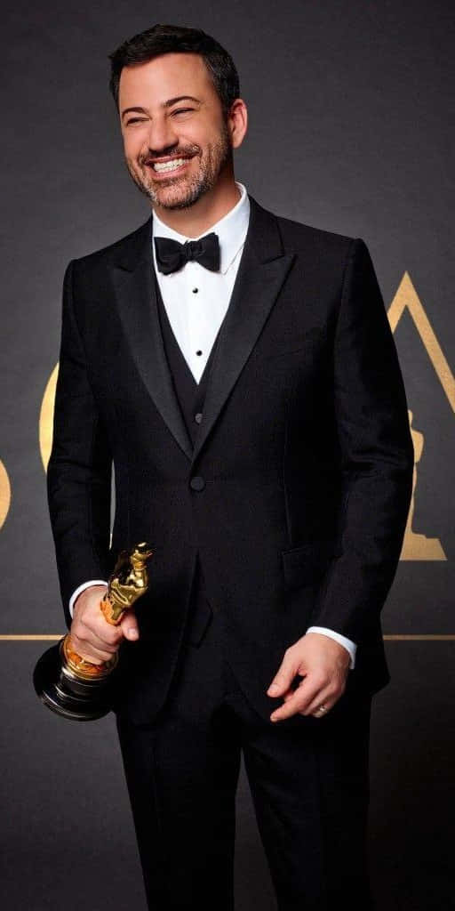 Jimmy Kimmel, black tuxedo, golden Oscar statue, SD Phone Wallpaper