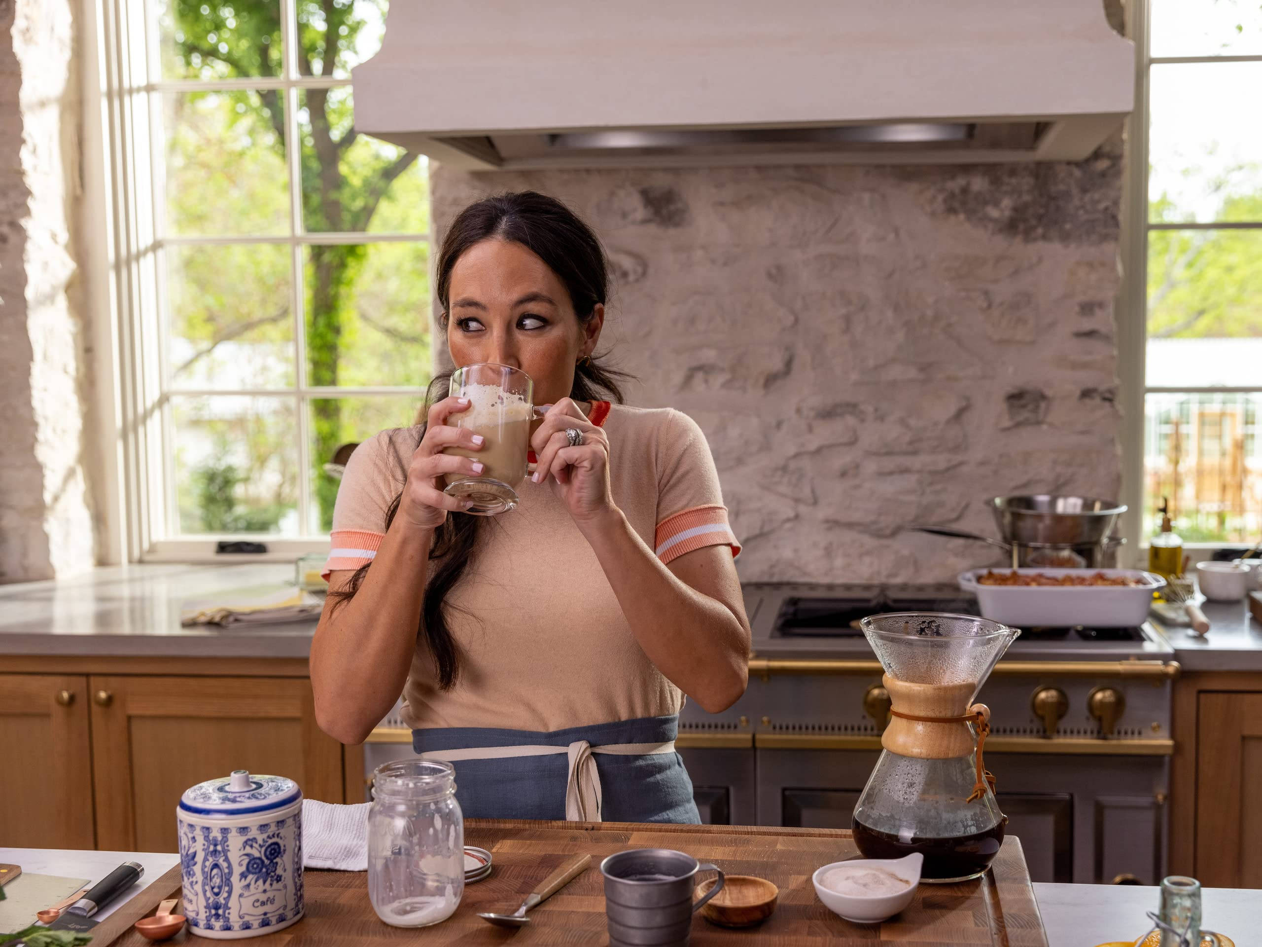 Joanna Gaines, sunlit rustic kitchen, stone walls, 2K Desktop Wallpaper