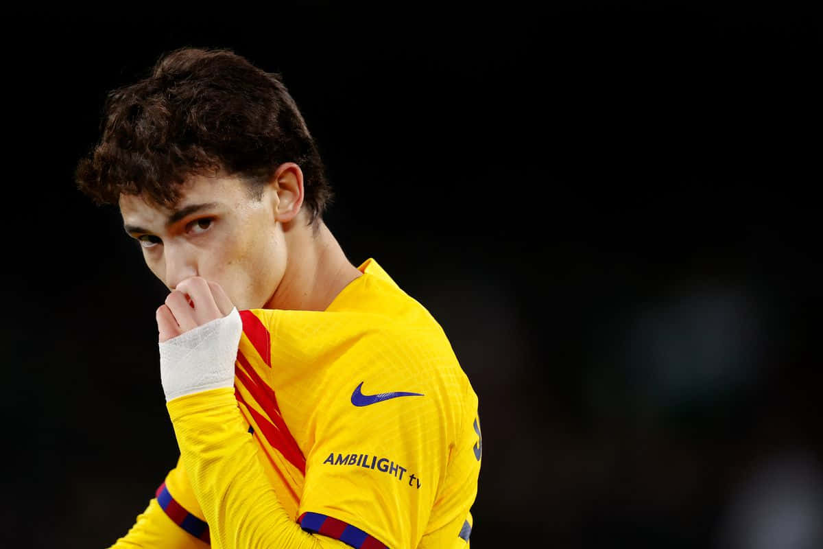 Joao Felix, yellow jersey with red stripes, hand near mouth, SD Desktop Wallpaper