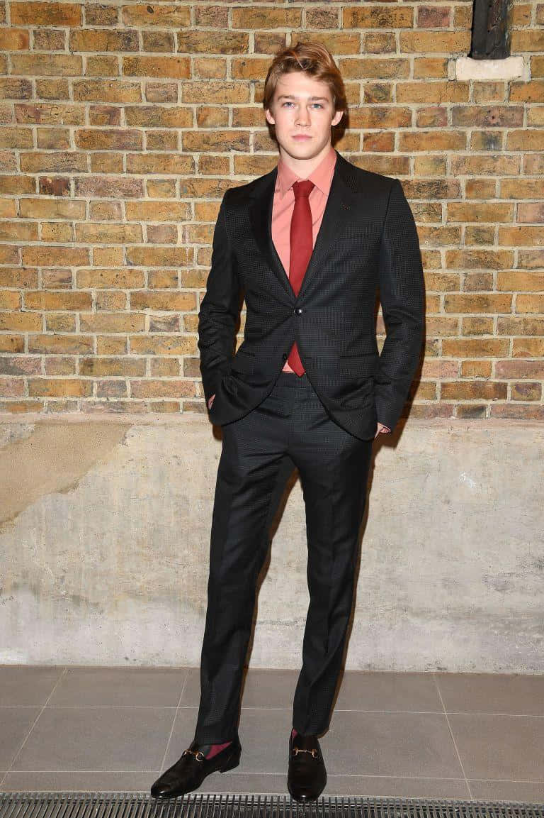 Joe Alwyn, black suit, red tie, SD Phone Wallpaper