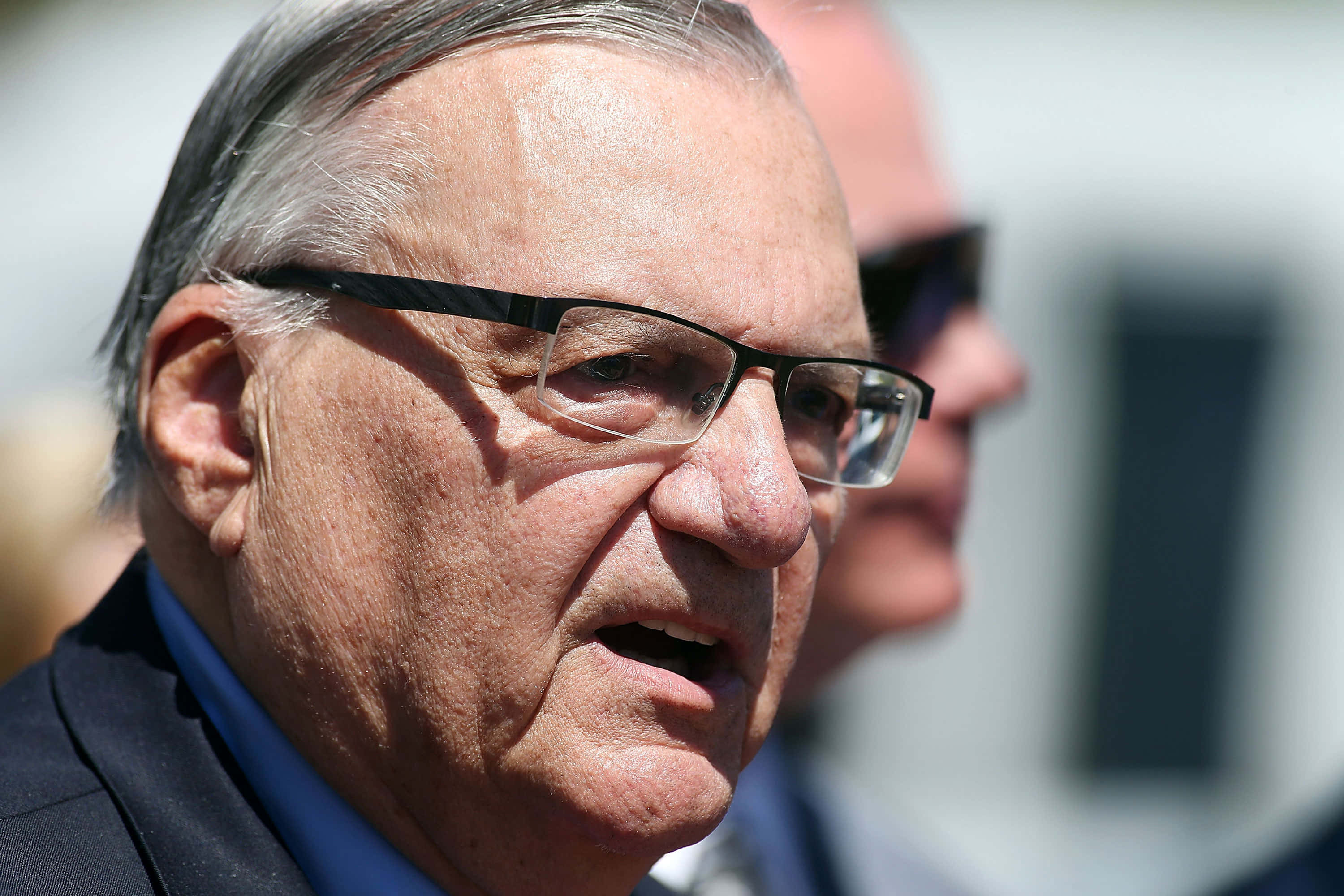 Joe Arpaio, press conference, outdoors, 2K Desktop Wallpaper