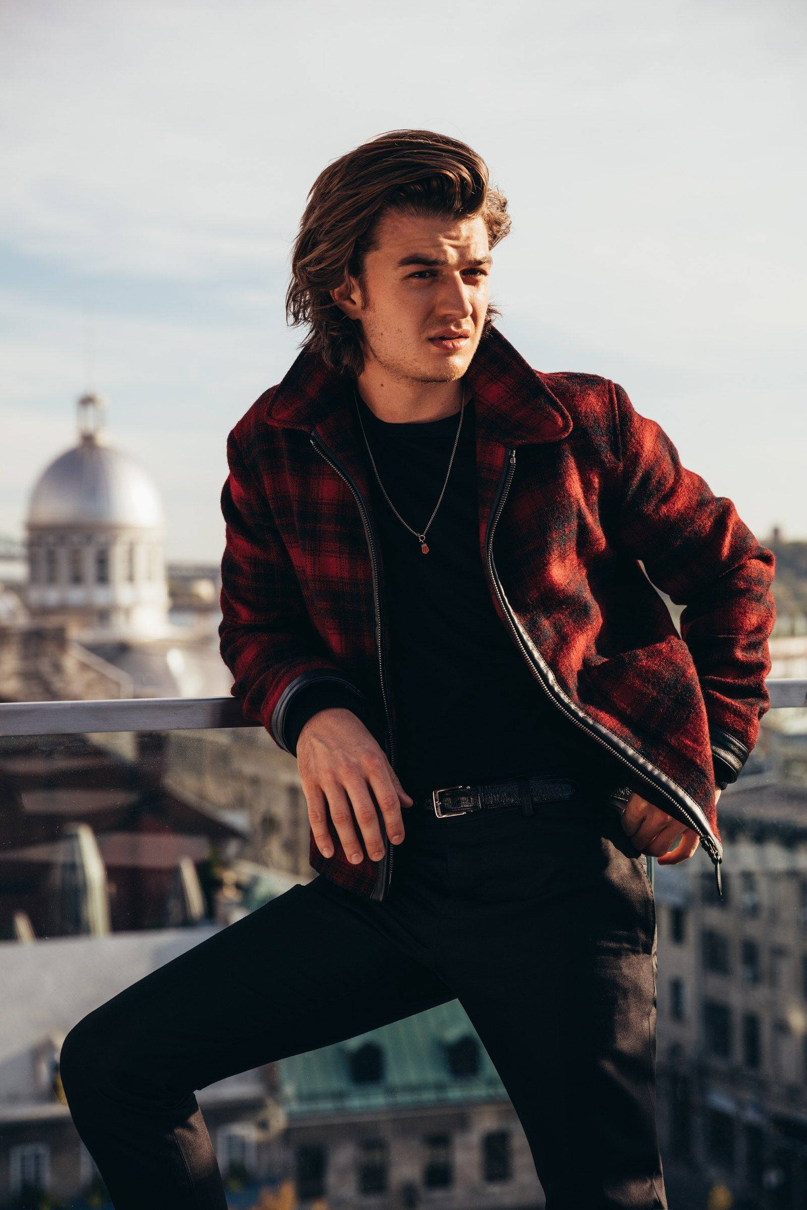 Joe Keery, red plaid jacket, rooftop railing, Full HD Phone Wallpaper