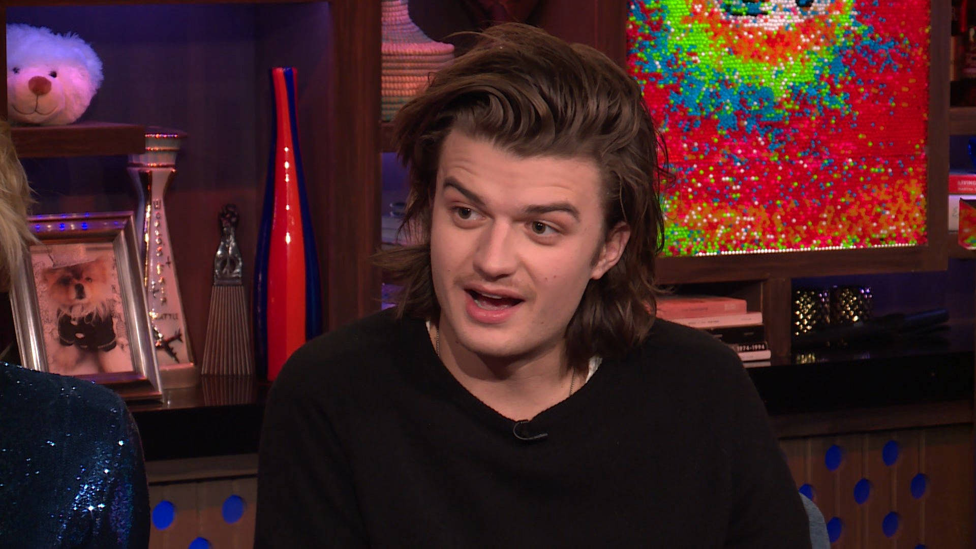 Joe Keery, black sweater, colorful talk show set, Full HD Desktop Wallpaper