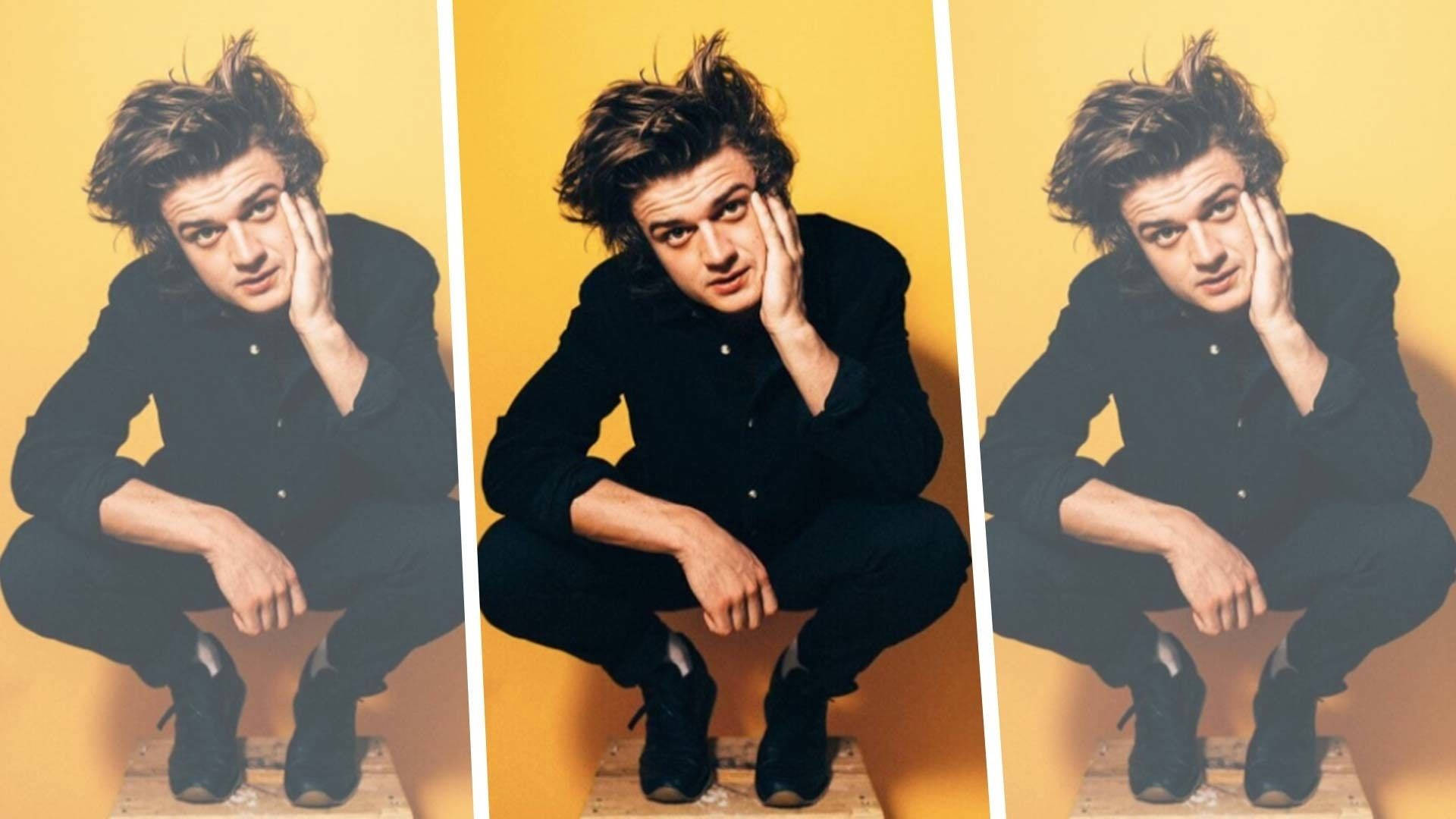Joe Keery, tousled hair, warm yellow wall, Full HD Desktop Wallpaper