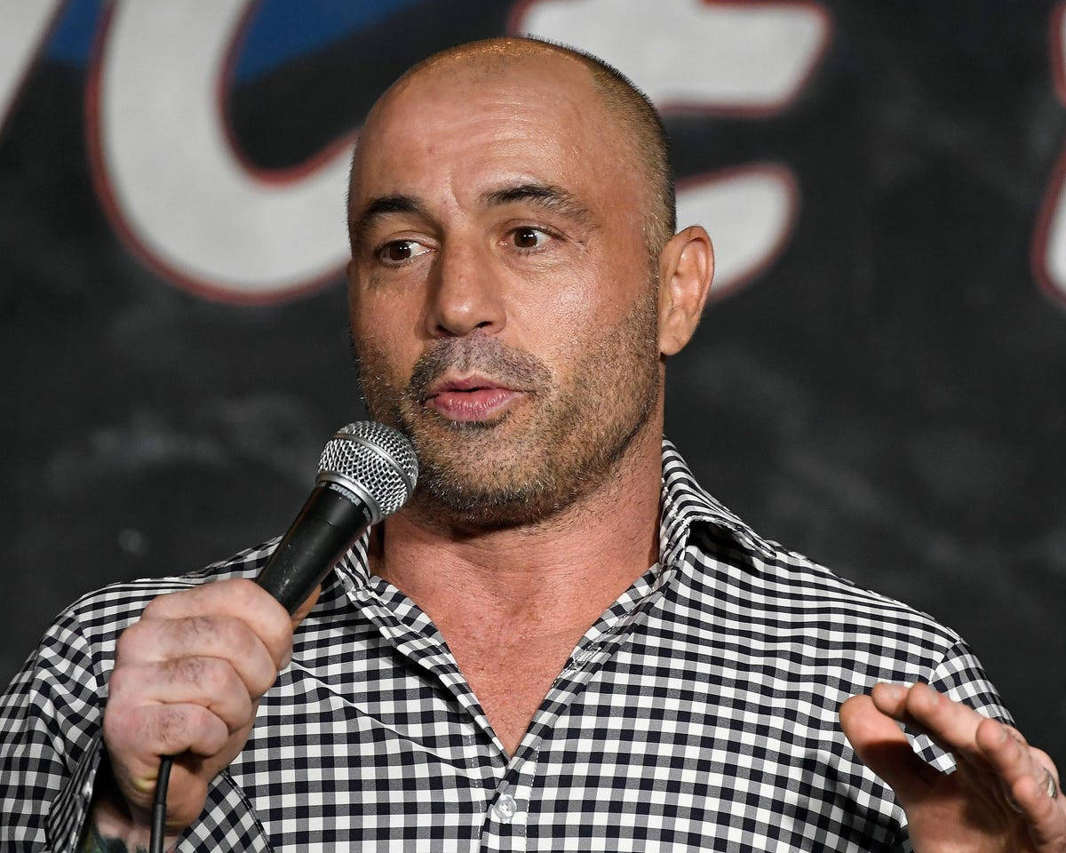 Joe Rogan, microphone, dark backdrop, SD Desktop Wallpaper