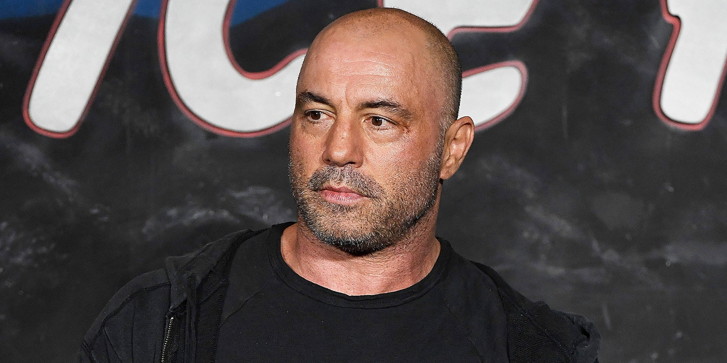 Joe Rogan, black t-shirt, dark wall, Full HD Desktop Wallpaper