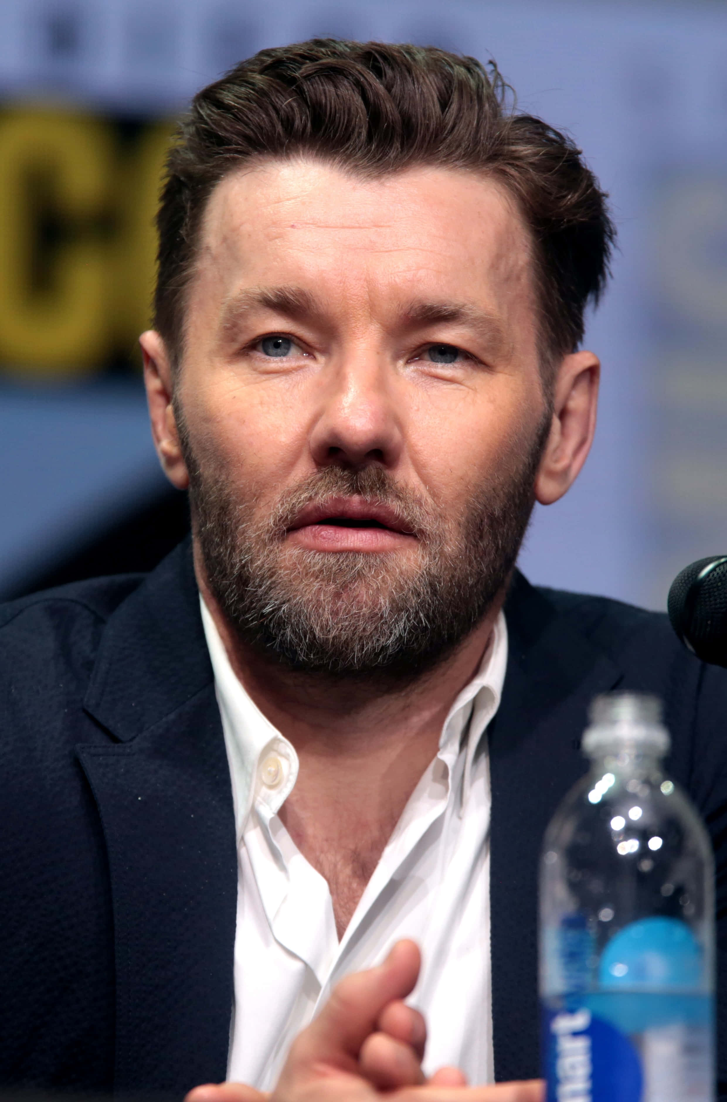Joel Edgerton, speaking at a panel, water bottle, 2K Phone Wallpaper