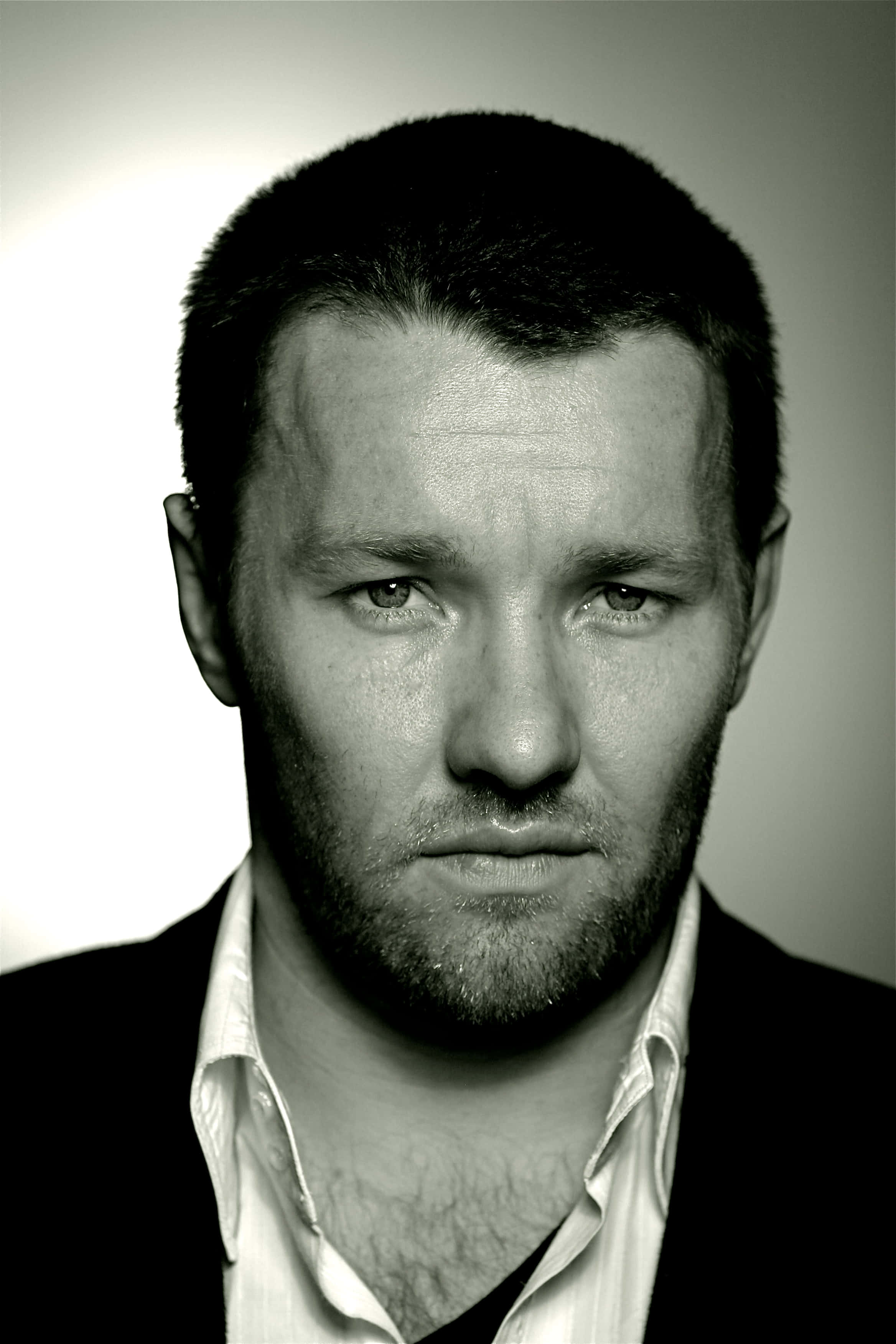 Joel Edgerton, black and white portrait, serious expression, 2K Phone Wallpaper