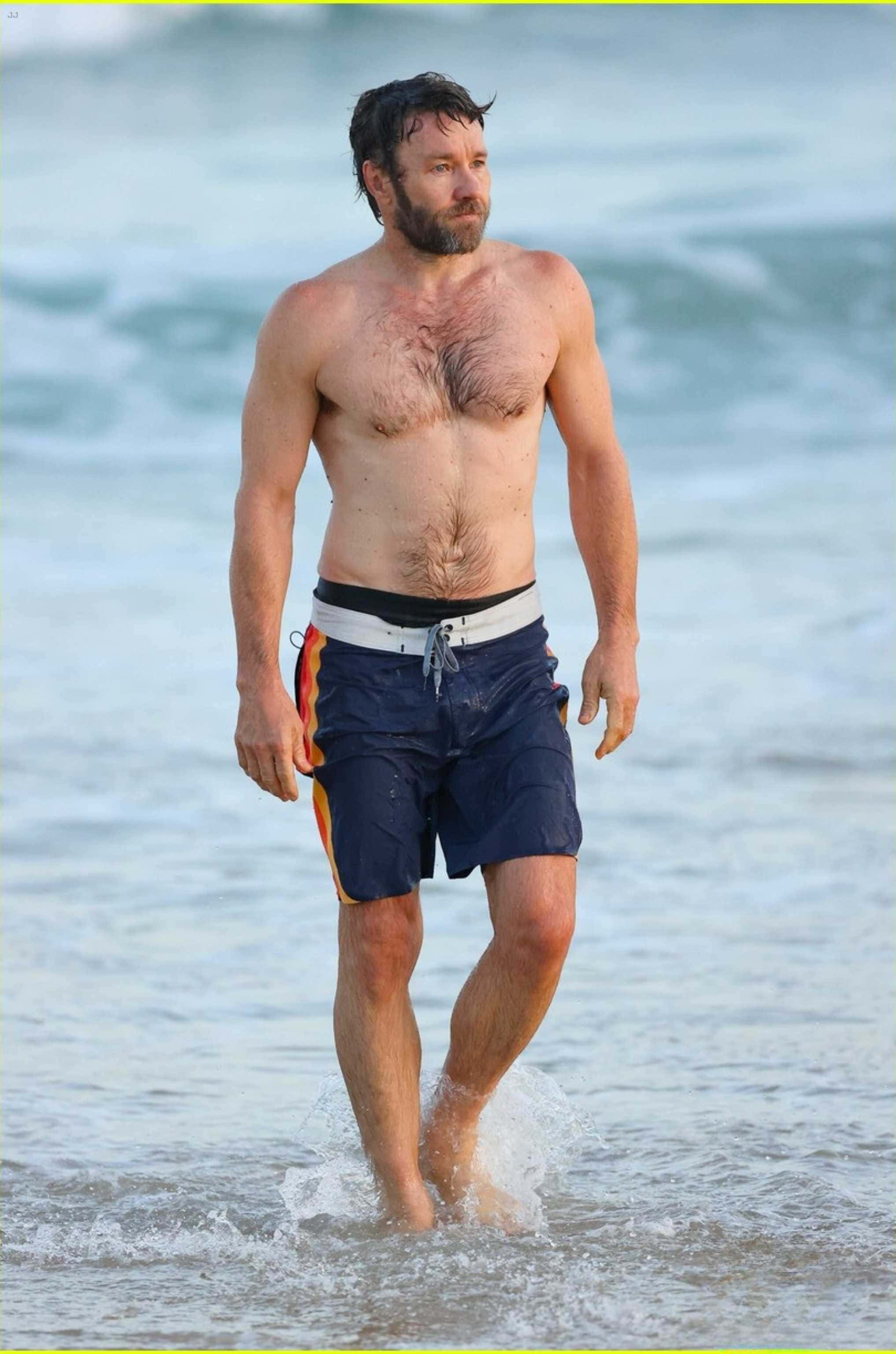 Joel Edgerton, beach, shallow ocean waves, 2K Phone Wallpaper