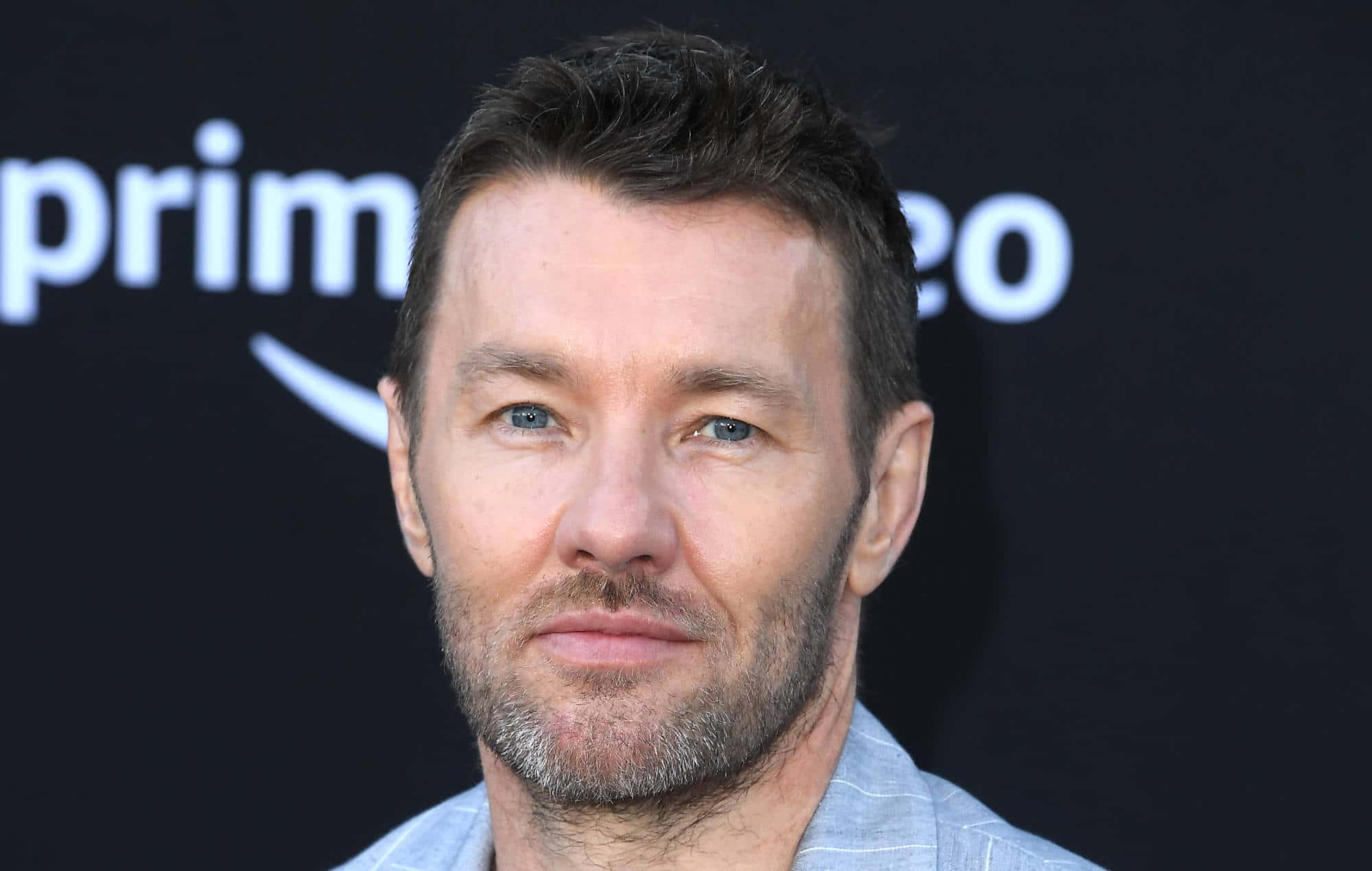 Joel Edgerton, black background, white Amazon Prime Video branding, Full HD Desktop Wallpaper