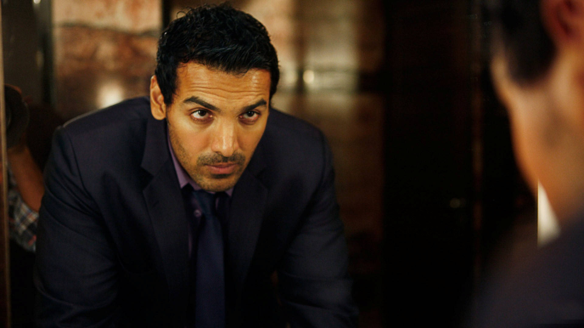 John Abraham, dark suit, dimly lit room, Full HD Desktop Wallpaper