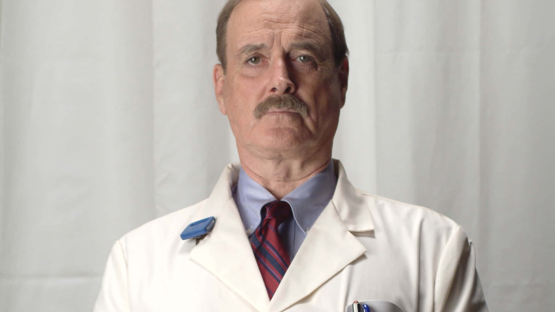 John Cleese, white lab coat, blue shirt, Full HD Desktop Wallpaper