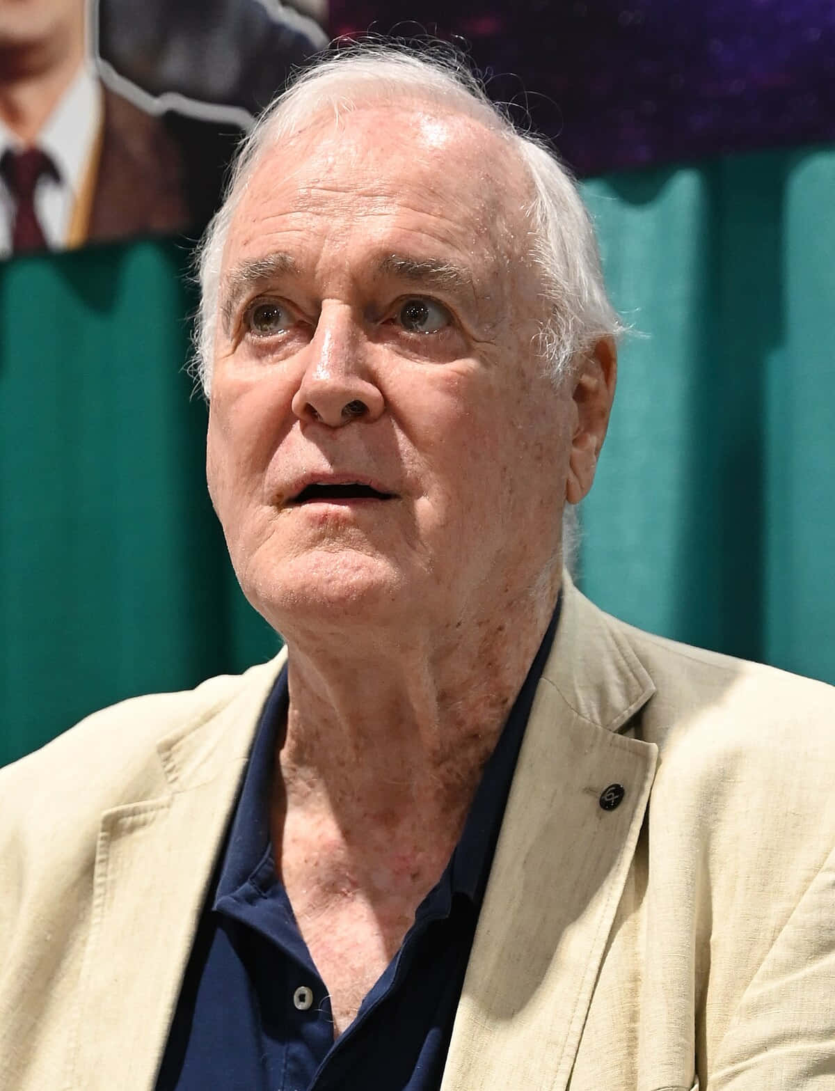 John Cleese, teal backdrop, beige blazer, HD Phone Wallpaper