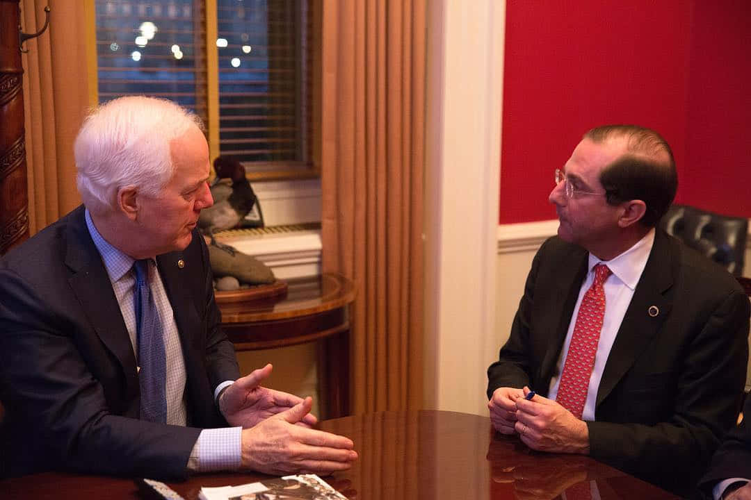 John Cornyn, polished wooden table, warmly lit office, SD Desktop Wallpaper