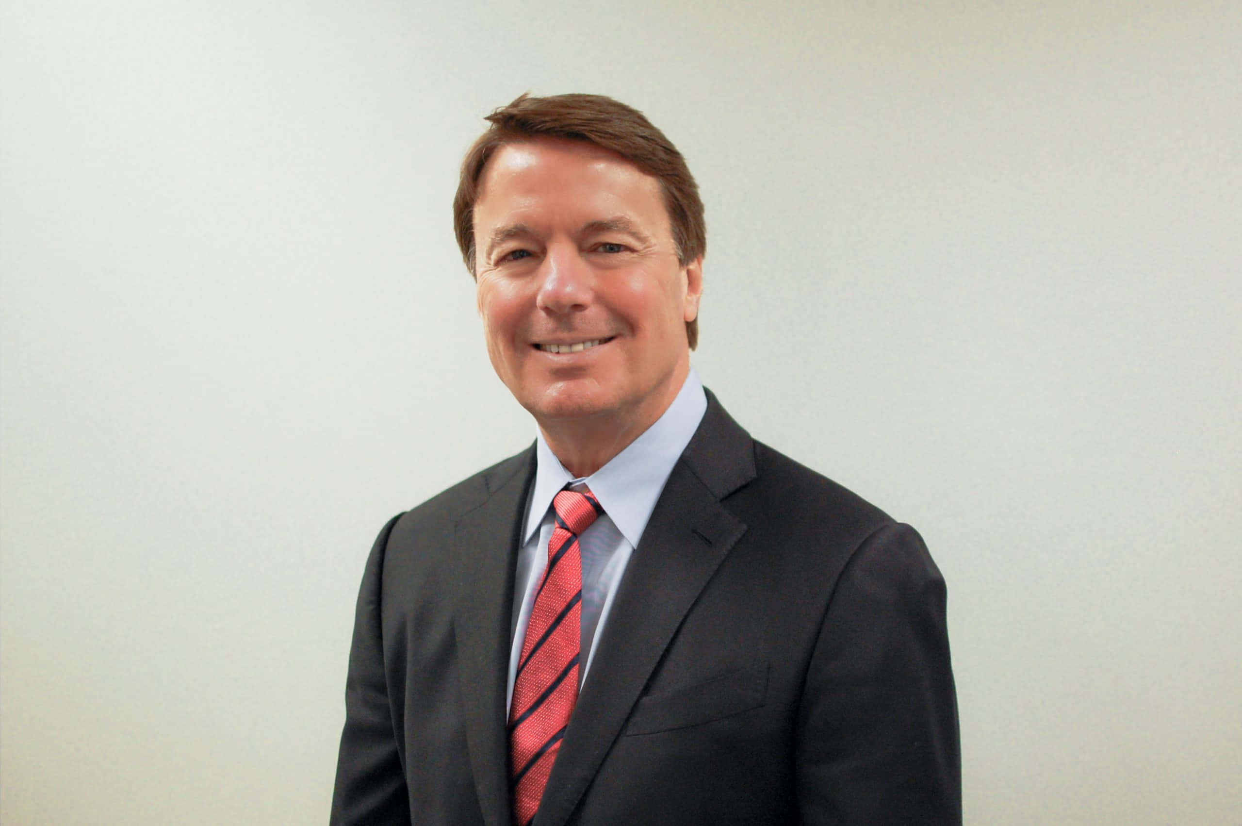 John Edwards, dark suit, red striped tie, 2K Desktop Wallpaper