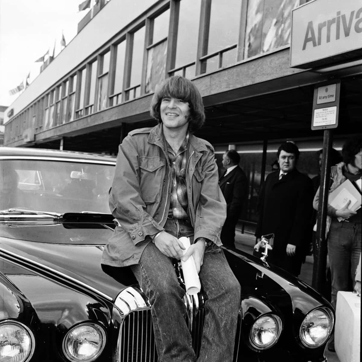 John Fogerty, sleek black vintage car, airport arrival terminal, SD Desktop Wallpaper