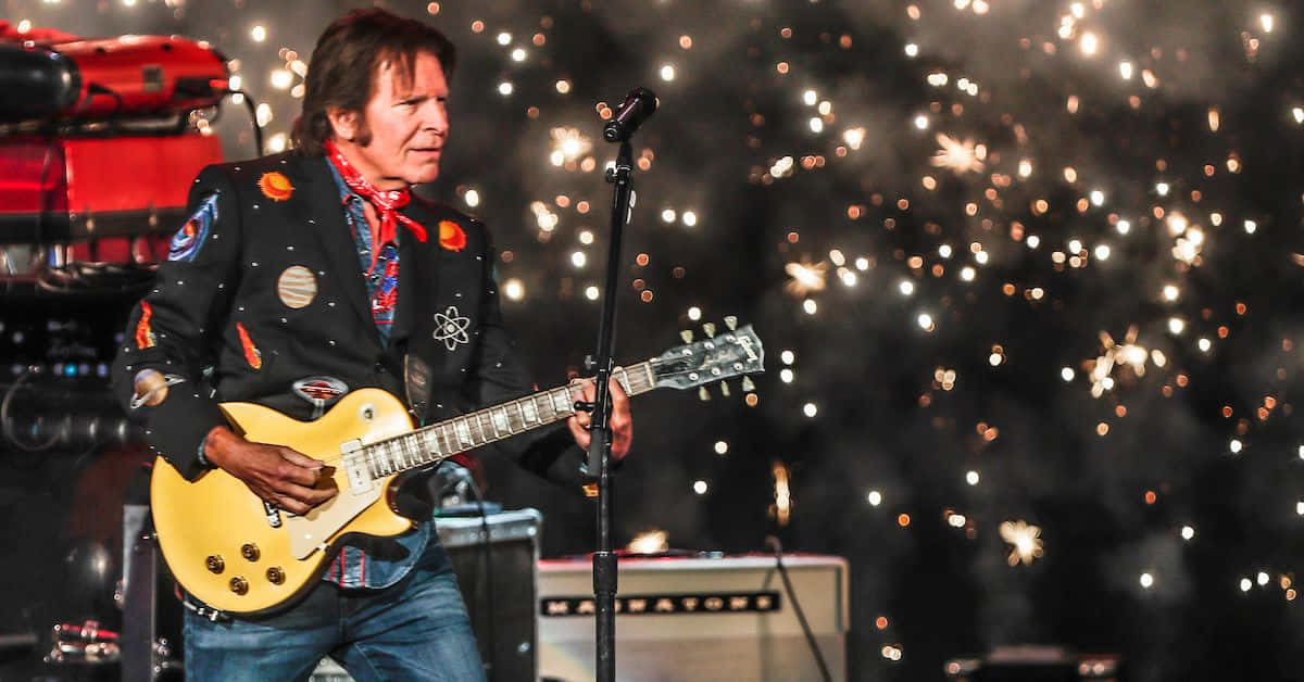 John Fogerty, yellow electric guitar, sparks, SD Desktop Wallpaper