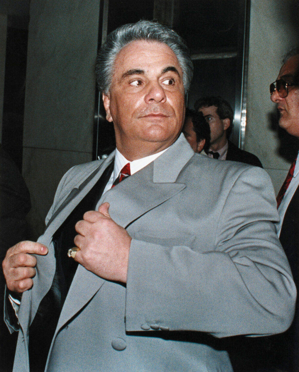 John Gotti, gray suit, dimly lit indoor setting, SD Phone Wallpaper