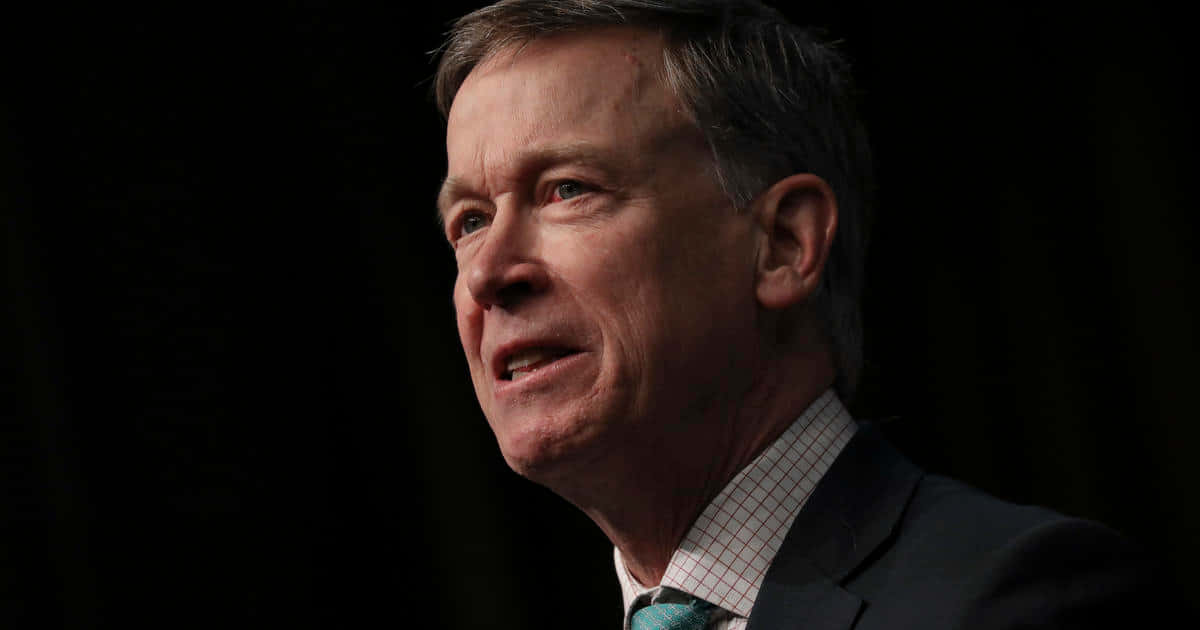 John Hickenlooper, black backdrop, suit and tie, SD Desktop Wallpaper