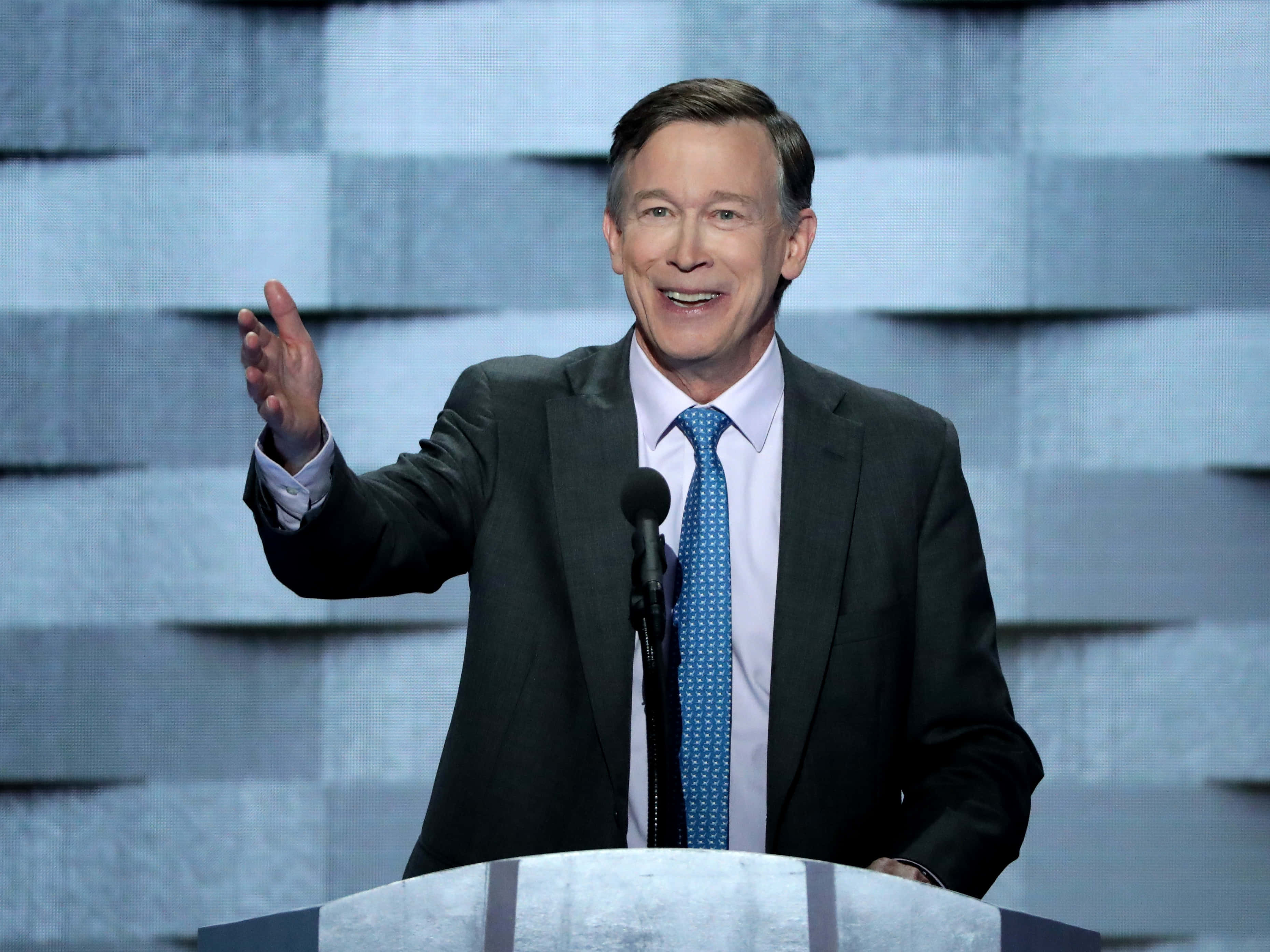 John Hickenlooper, dark suit, blue patterned tie, 2K Desktop Wallpaper