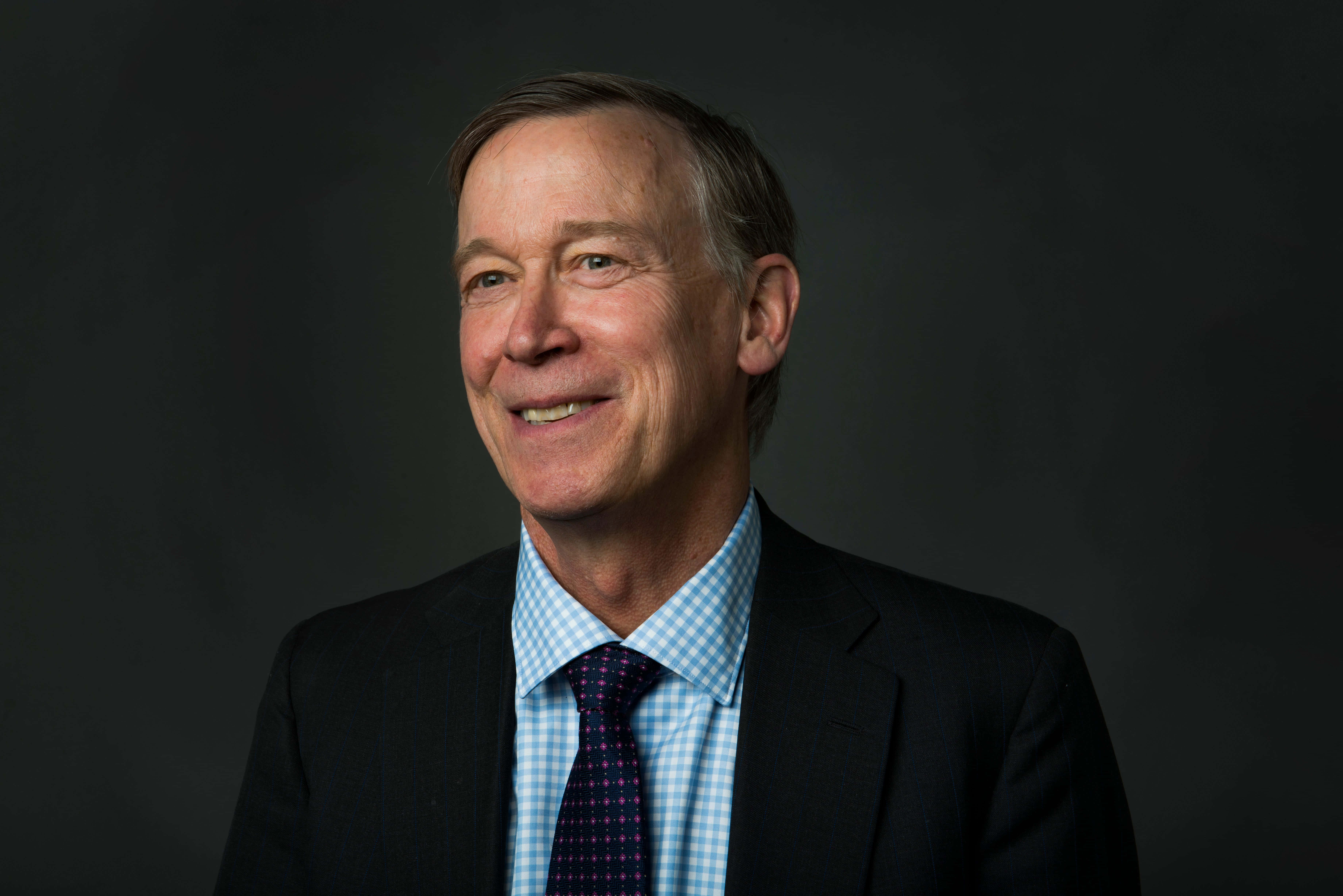 John Hickenlooper, dark gray background, dark suit, 5K Desktop Wallpaper