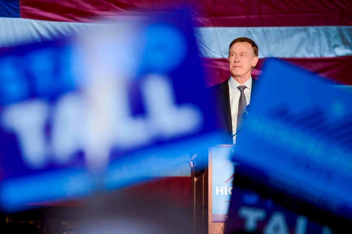 John Hickenlooper, podium, blue campaign signs, SD Desktop Wallpaper