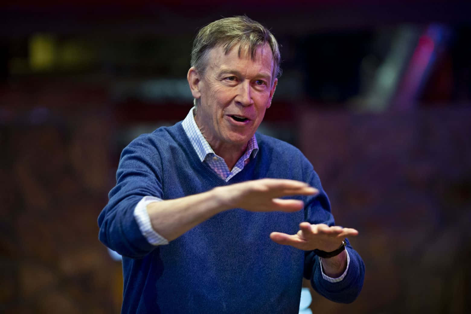 John Hickenlooper, blue sweater, dimly lit indoor setting, HD Desktop Wallpaper
