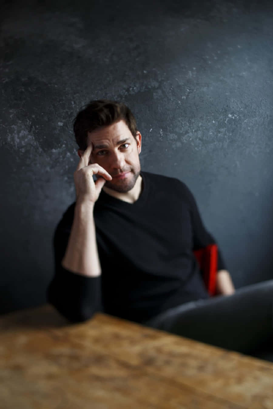 John Krasinski, black shirt, wooden table, HD Phone Wallpaper