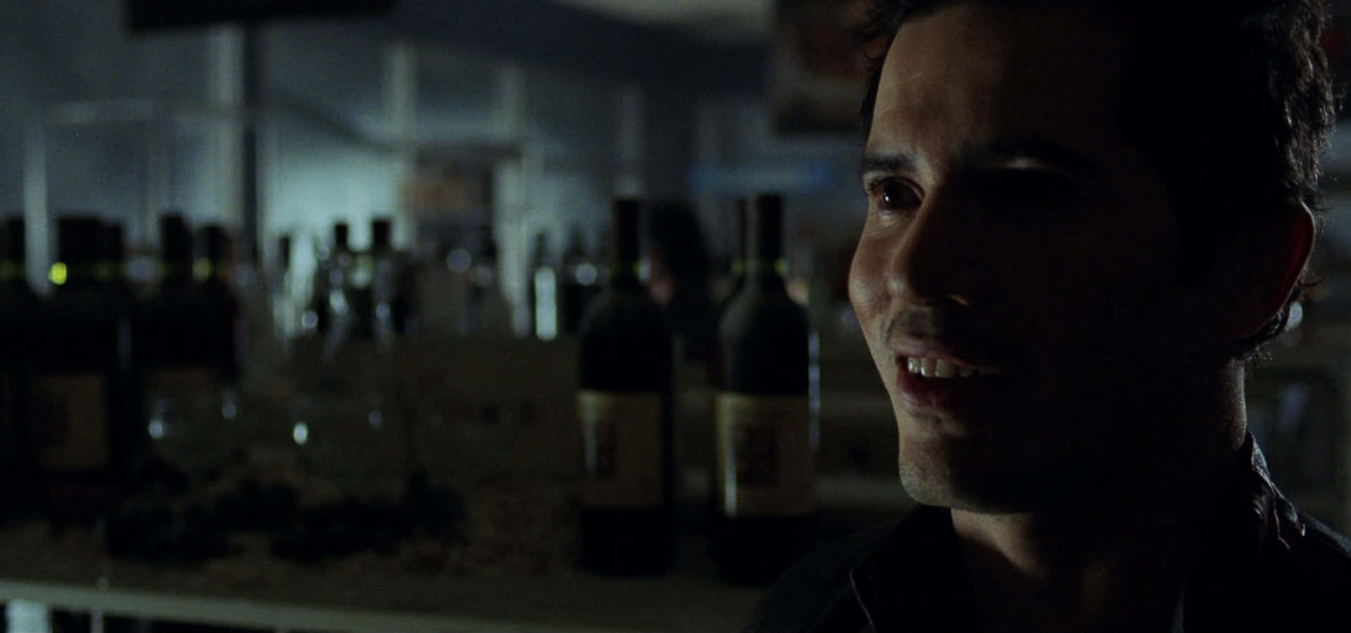 John Leguizamo, dim light, shelves of wine bottles, Full HD Desktop Wallpaper