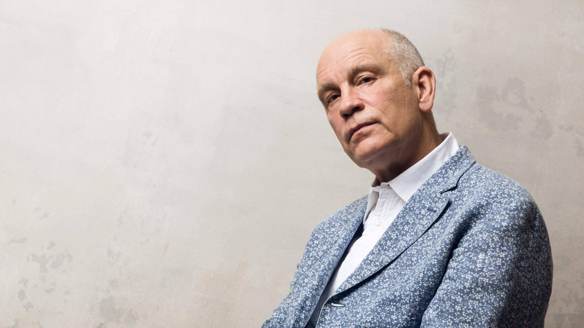 John Malkovich, blue patterned blazer, textured off-white wall, Full HD Desktop Wallpaper