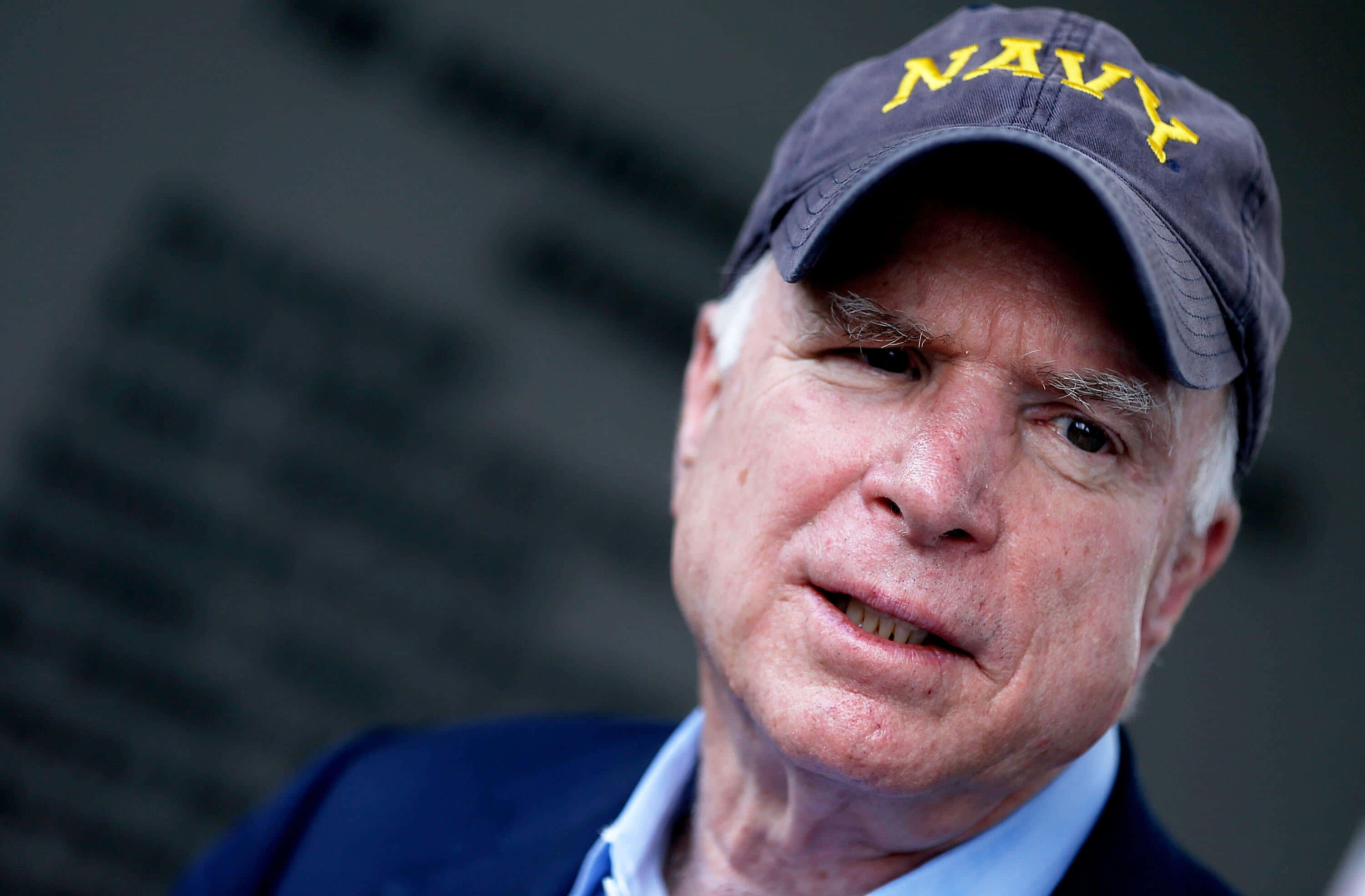 John McCain, navy blue cap, yellow 'NAVY' lettering, 2K Desktop Wallpaper