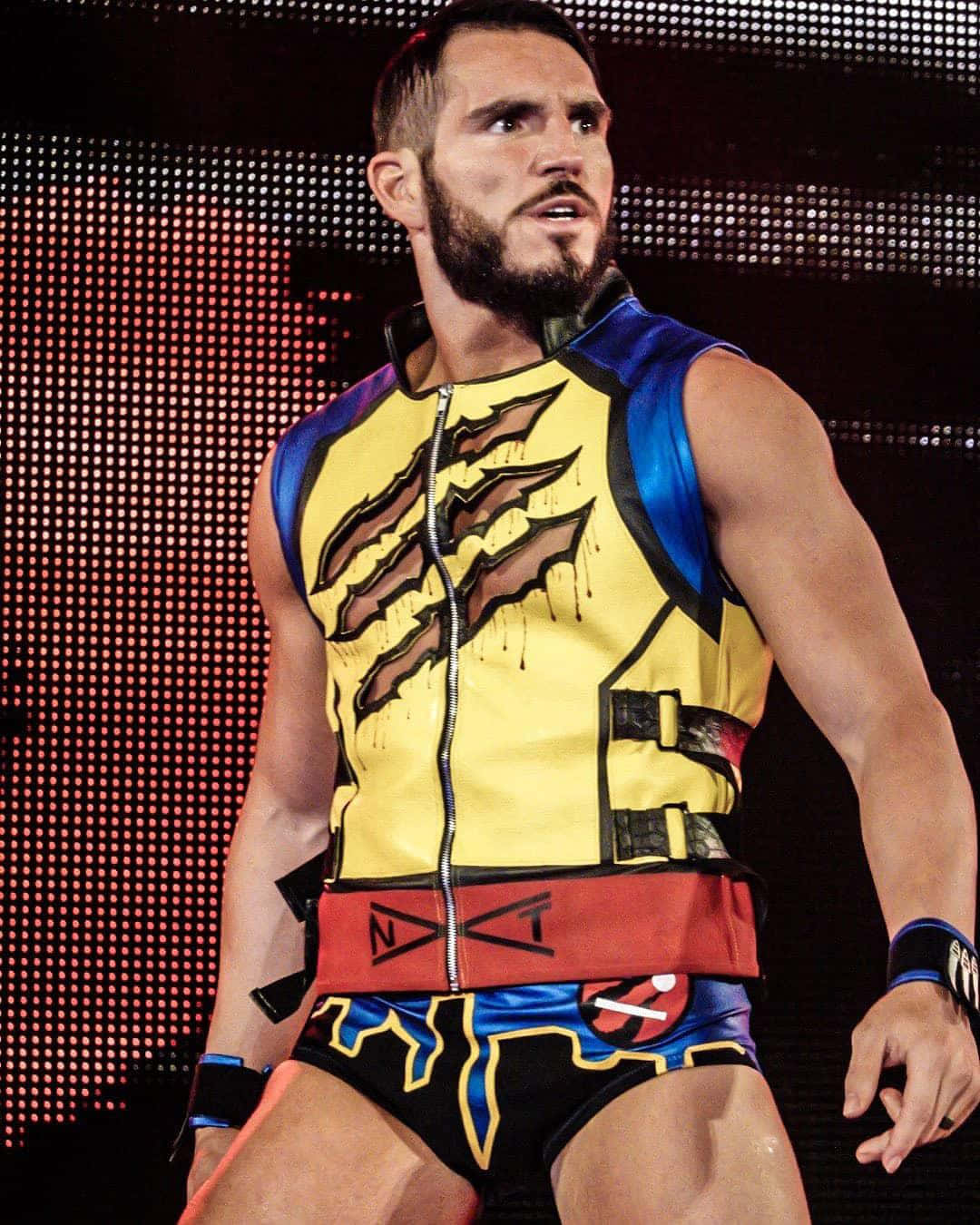 Johnny Gargano, vibrant yellow blue and red costume, stage lights, HD Phone Wallpaper